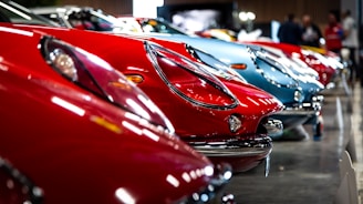A row of classic cars parked next to each other
