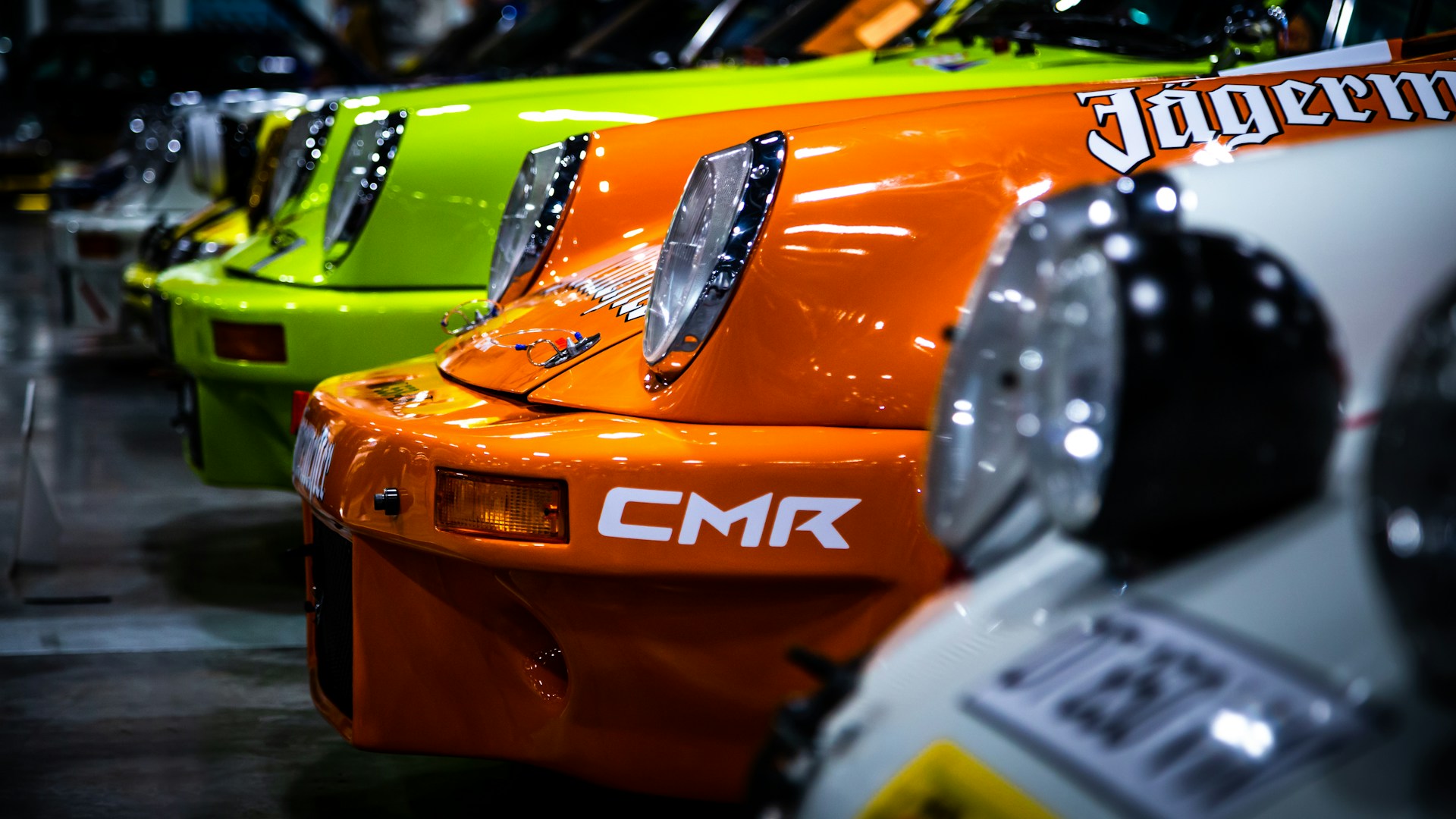 A row of colorful cars parked next to each other