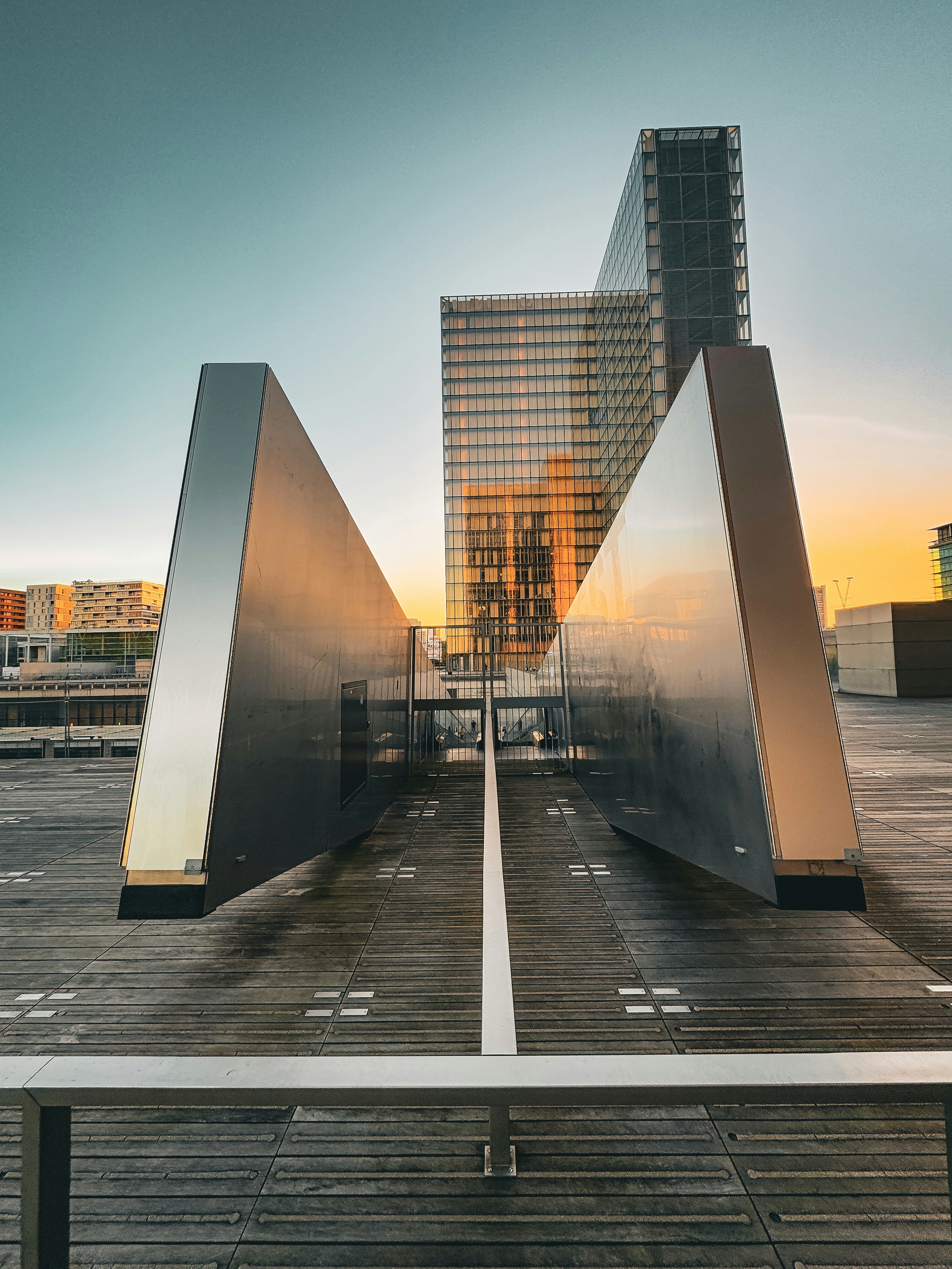 A large metal sculpture sitting on top of a parking lot