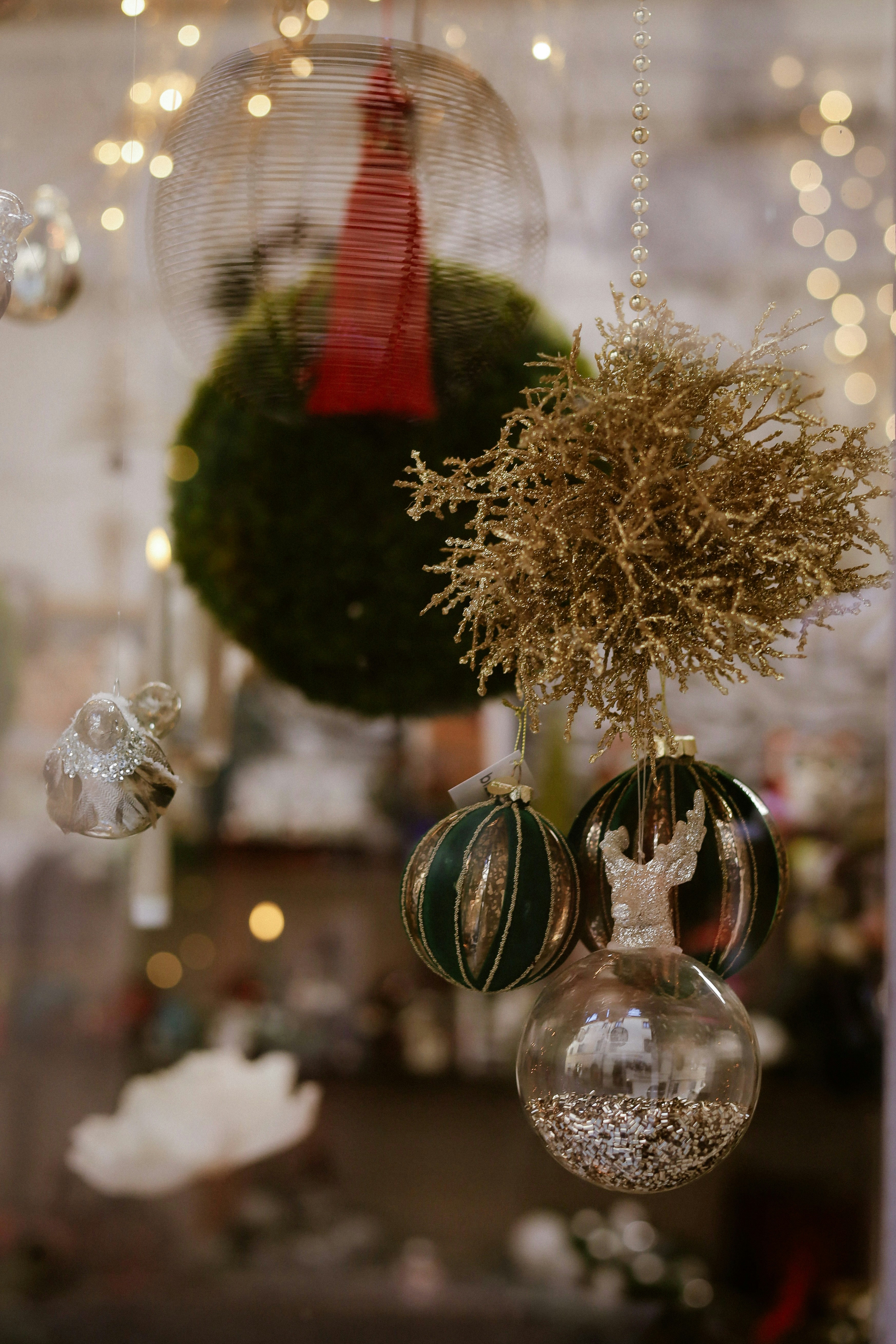 A bunch of ornaments hanging from a ceiling photo – Free Christmas Image on  Unsplash, image size:3000x4500