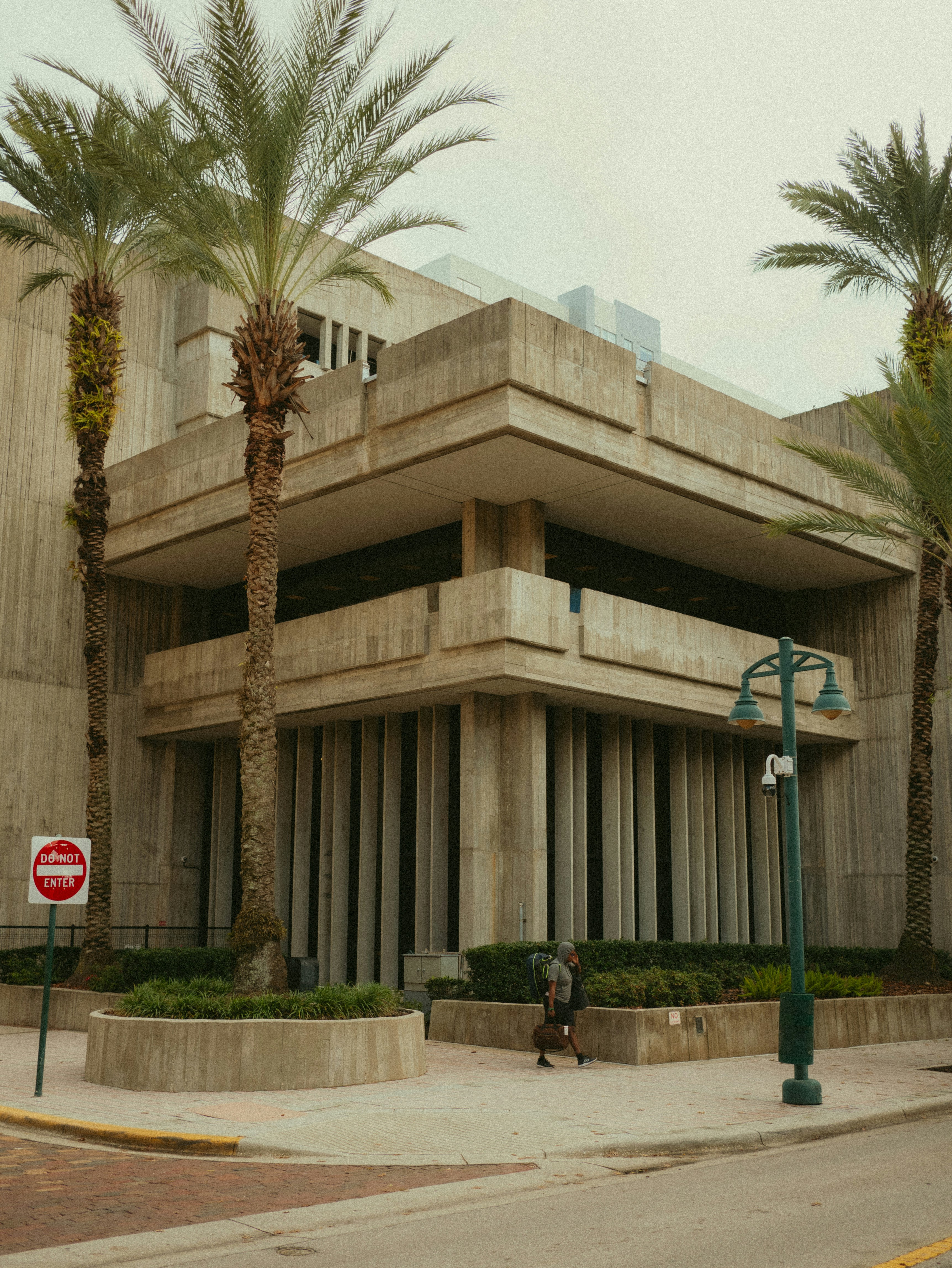 A building with palm trees in front of it