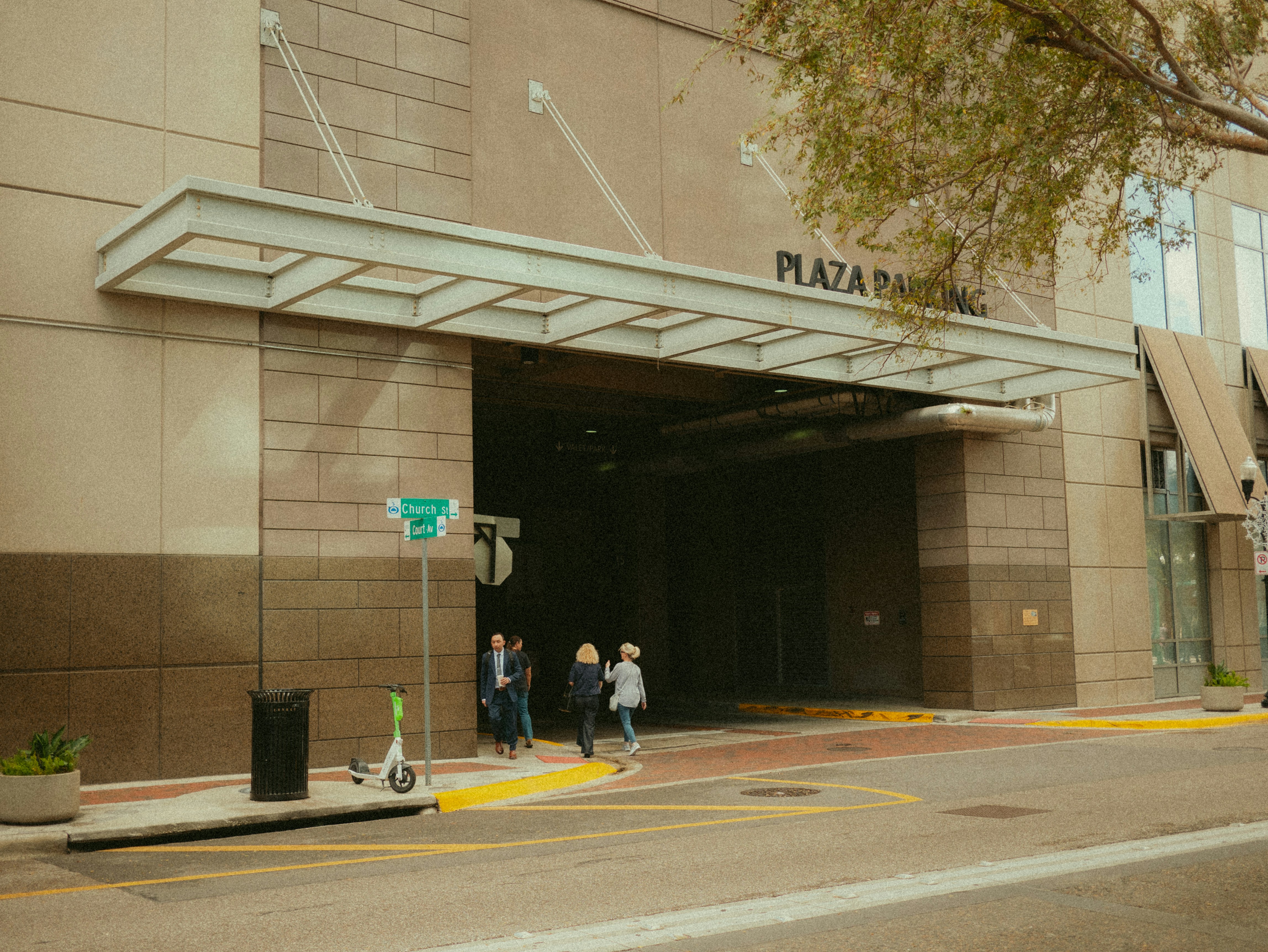 A group of people standing outside of a building