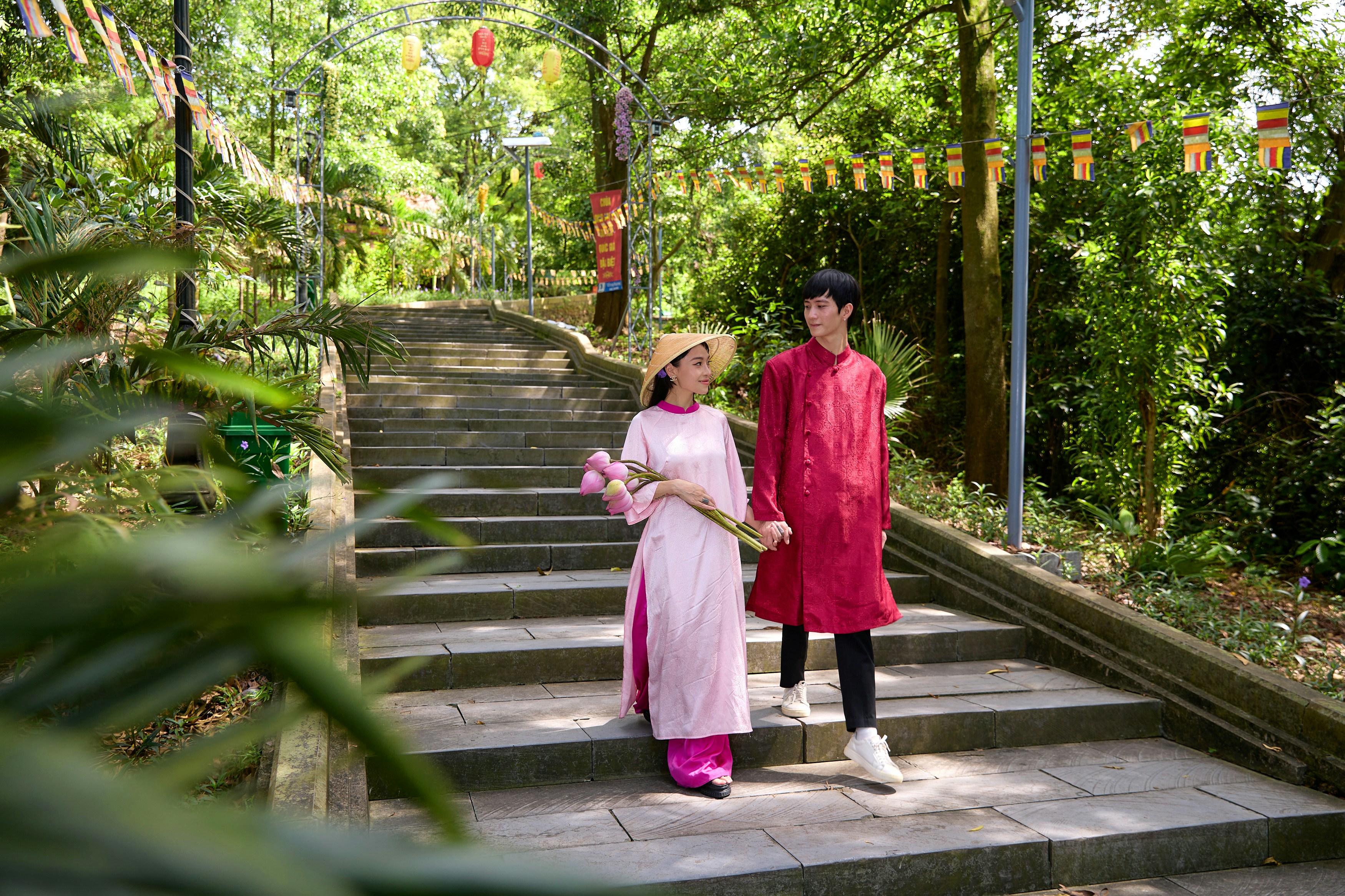 A man and a woman standing on a set of stairs
