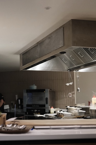 A man standing in a kitchen preparing food