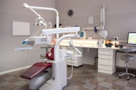 A dental room with a desk and chair