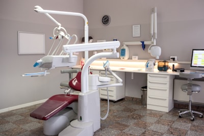 A dental room with a desk and chair