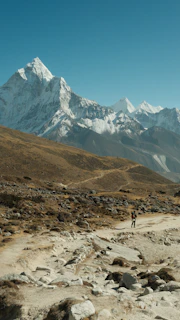 A man riding a bike down a dirt road