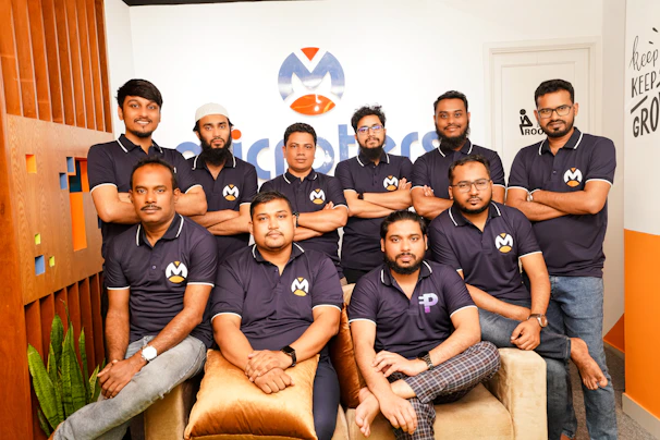 A group of men sitting next to each other