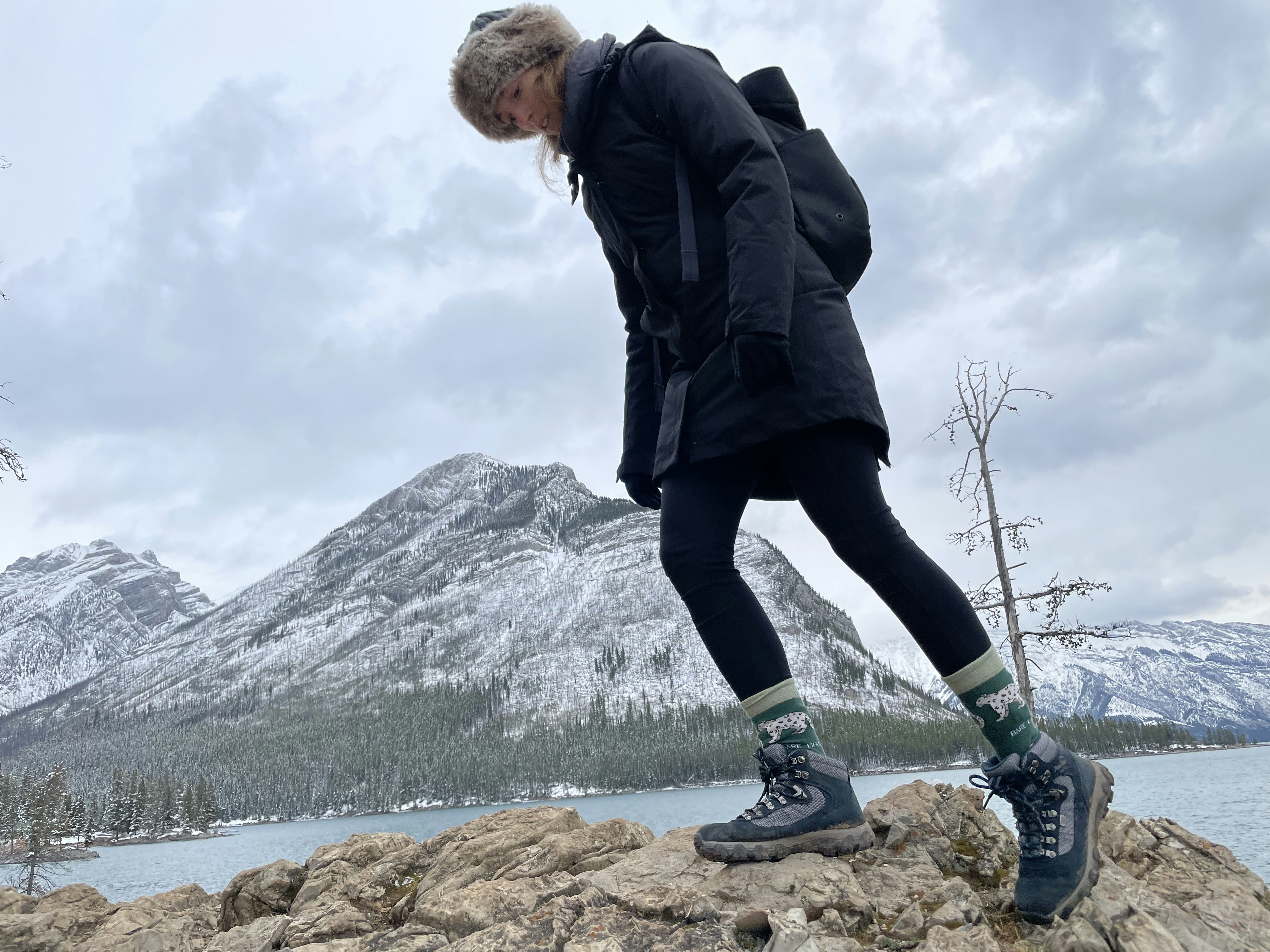 Camille Okafor, female backcountry guide, warm outdoor winter portrait, natural light