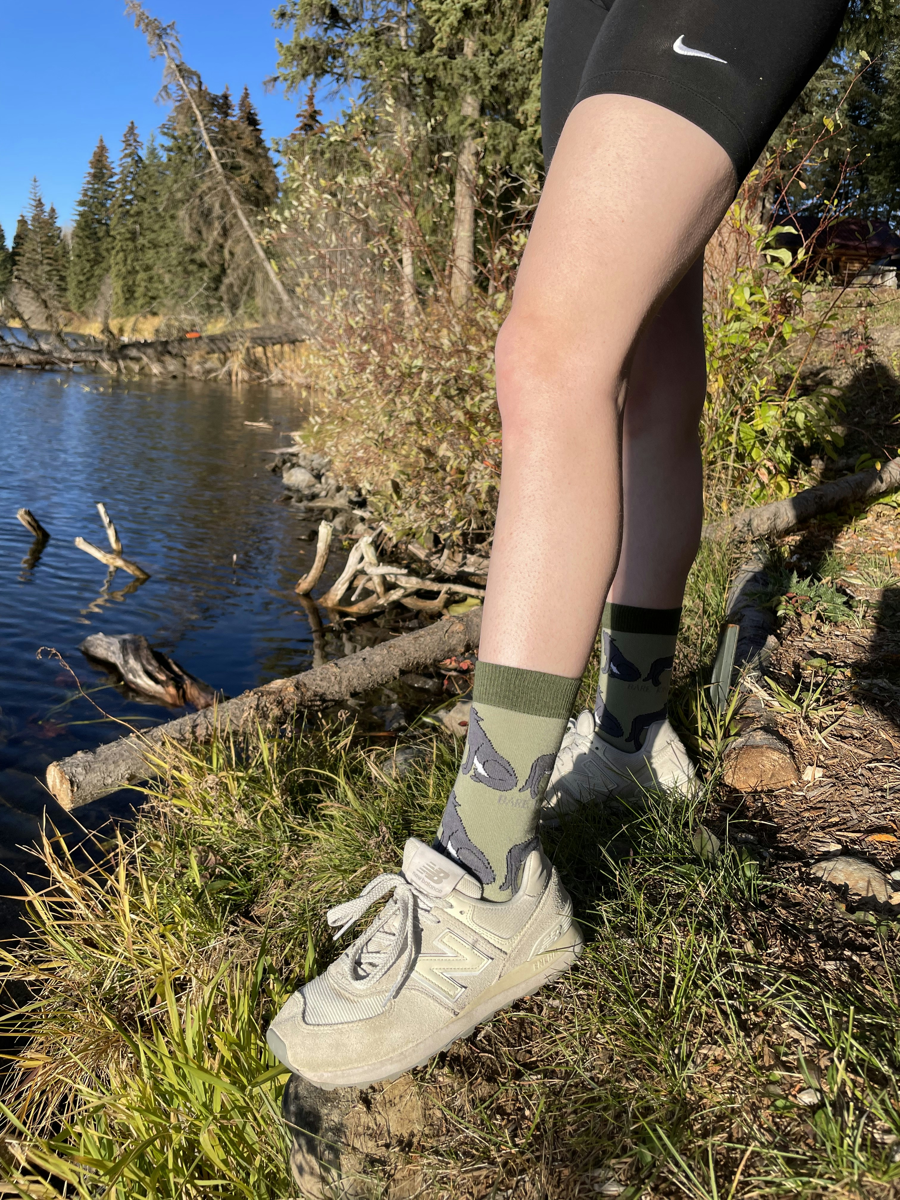 A person standing next to a body of water