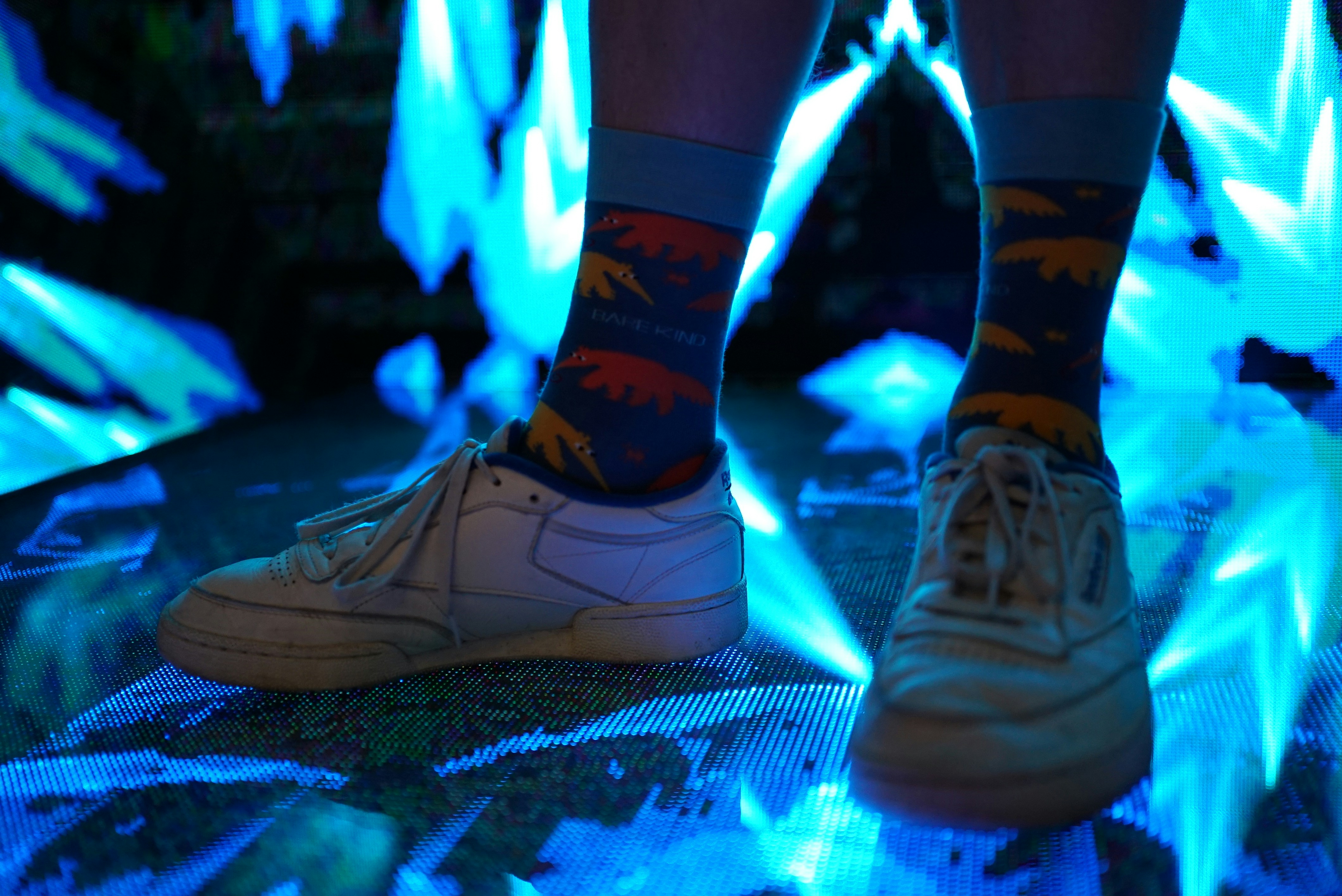 A person standing in front of blue flames