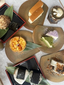 A table topped with plates filled with different types of food
