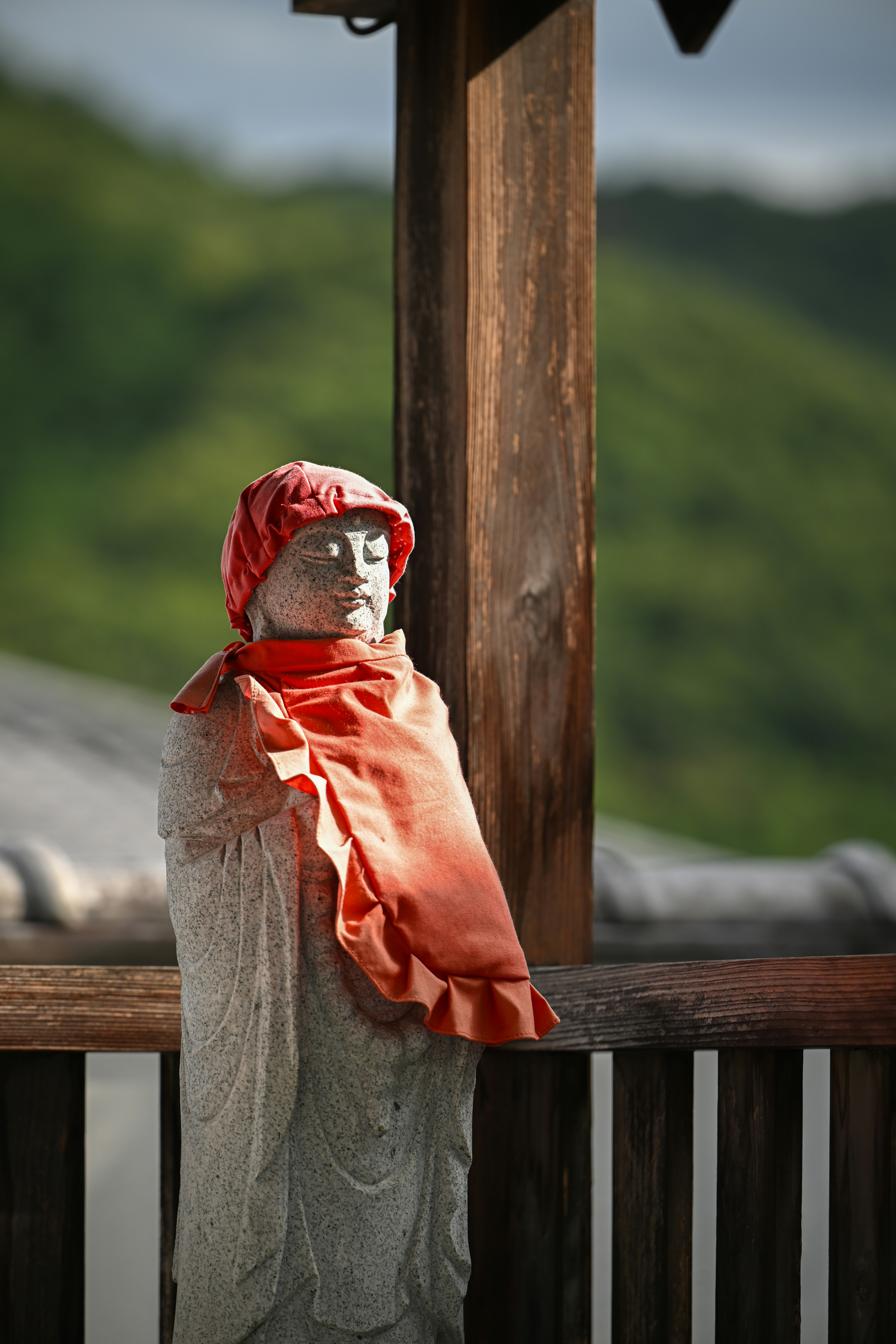 A statue of a person wearing a red scarf