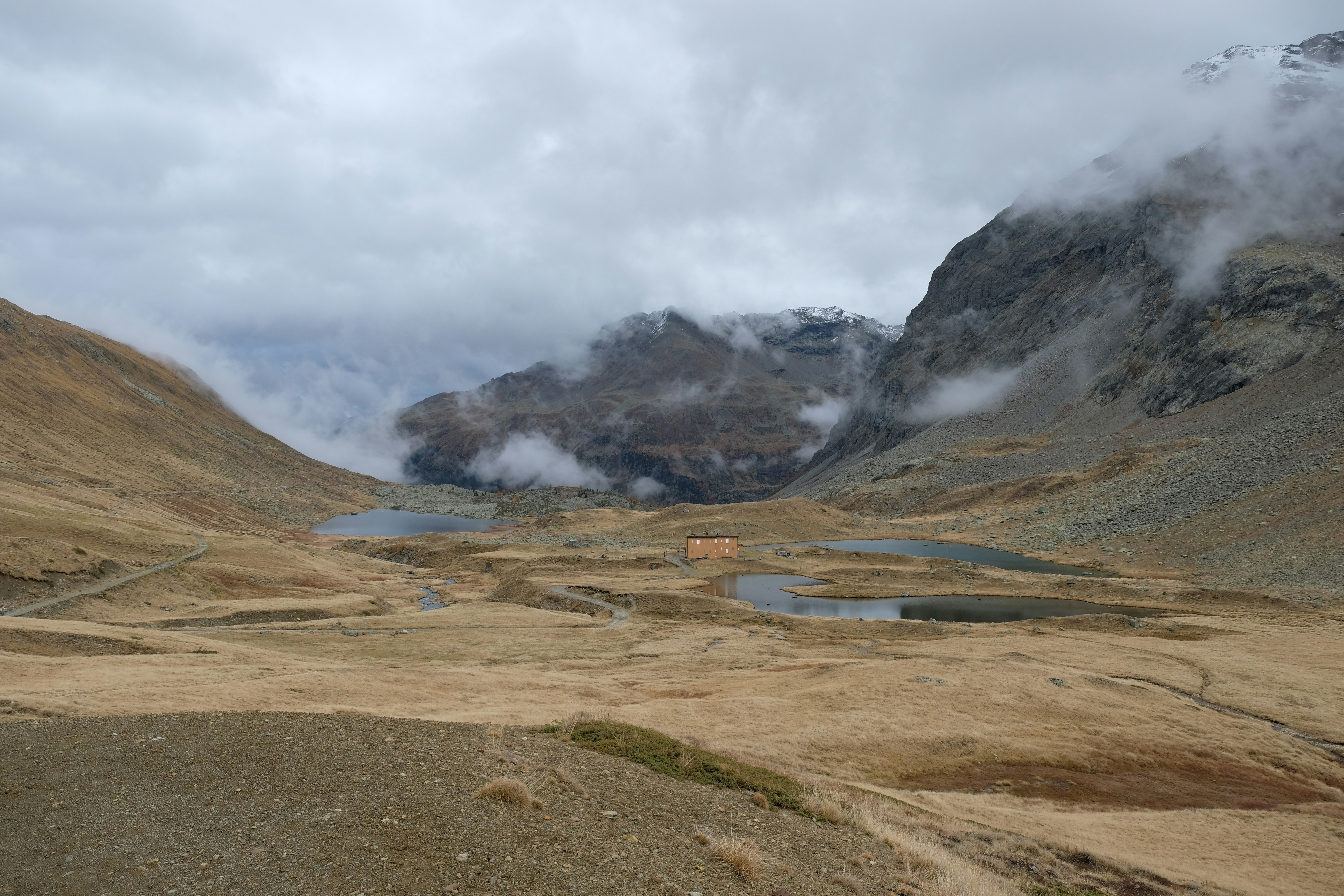 A view of a valley with mountains in the background