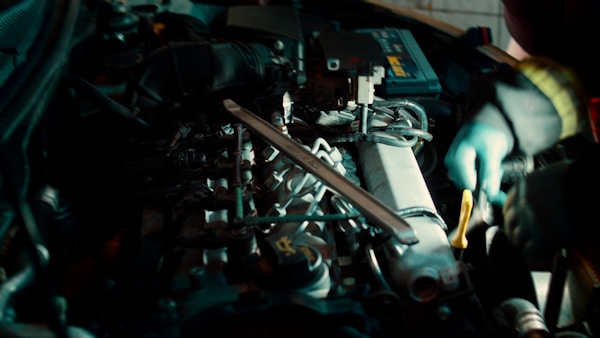 A man working on a machine in a garage
