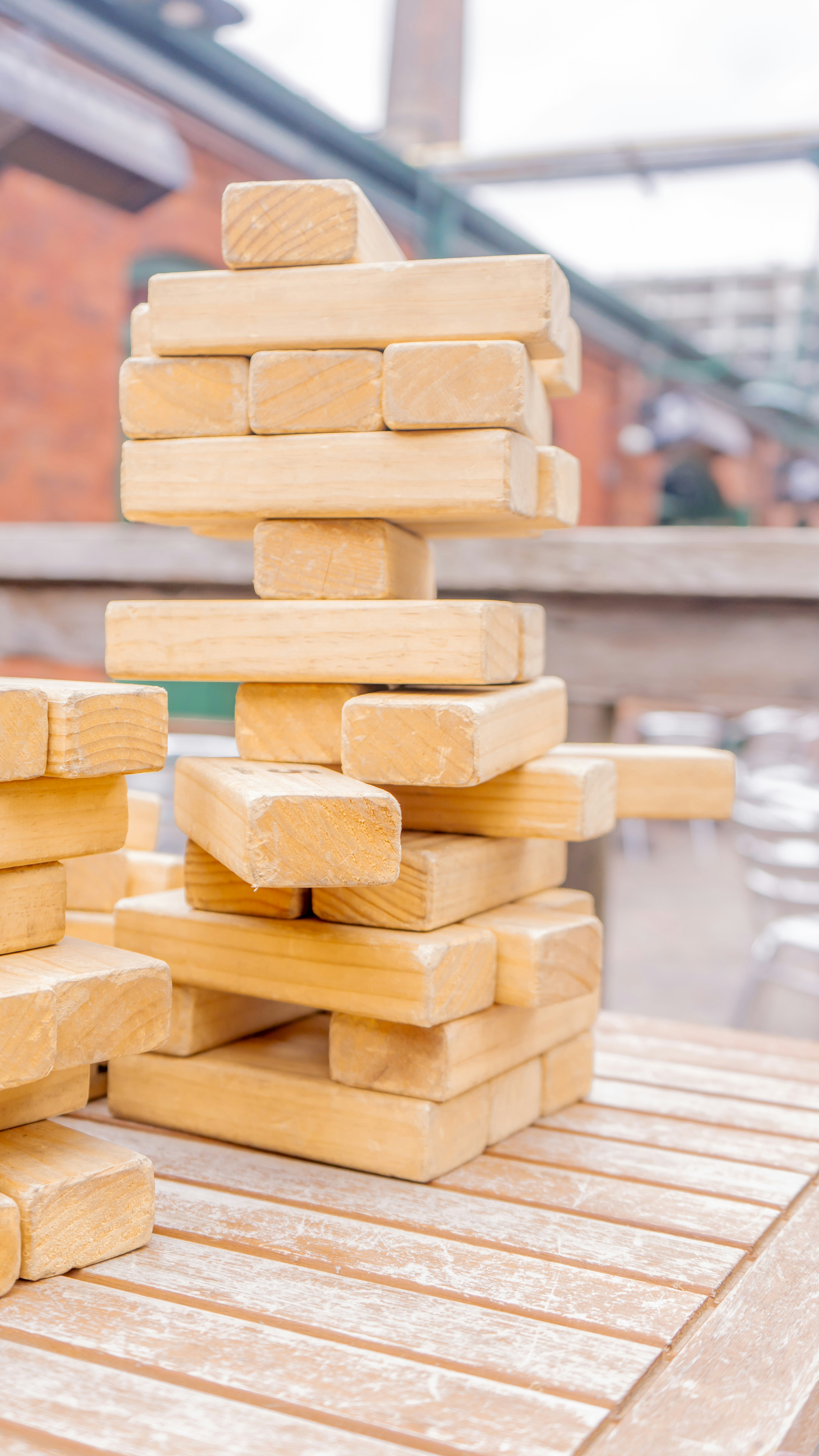 A stack of wooden blocks sitting on top of a wooden table