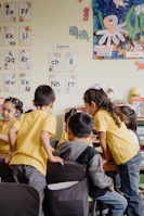 A group of children sitting at desks in a classroom