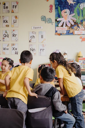 A group of children sitting at desks in a classroom