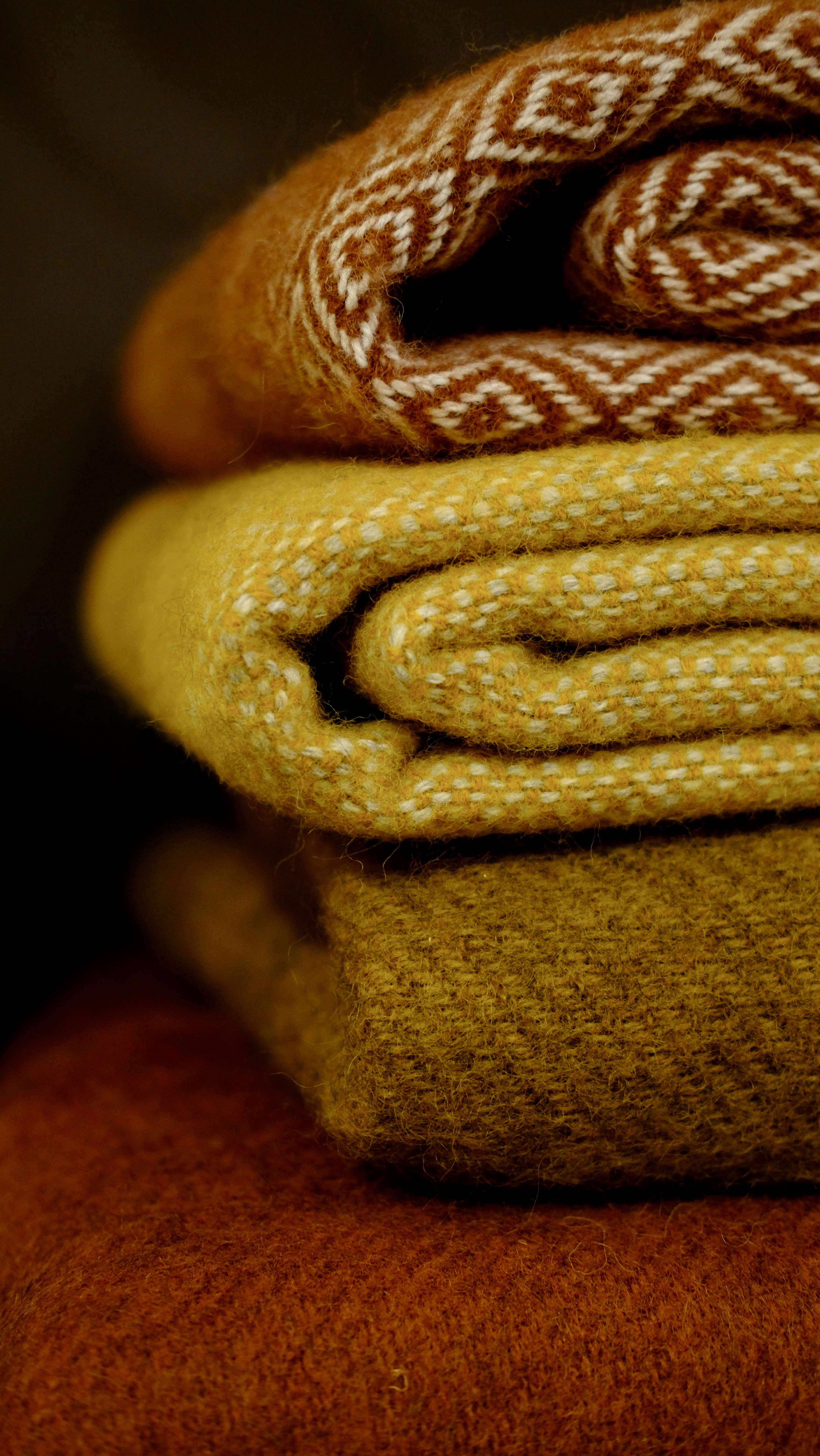 A stack of blankets sitting on top of each other