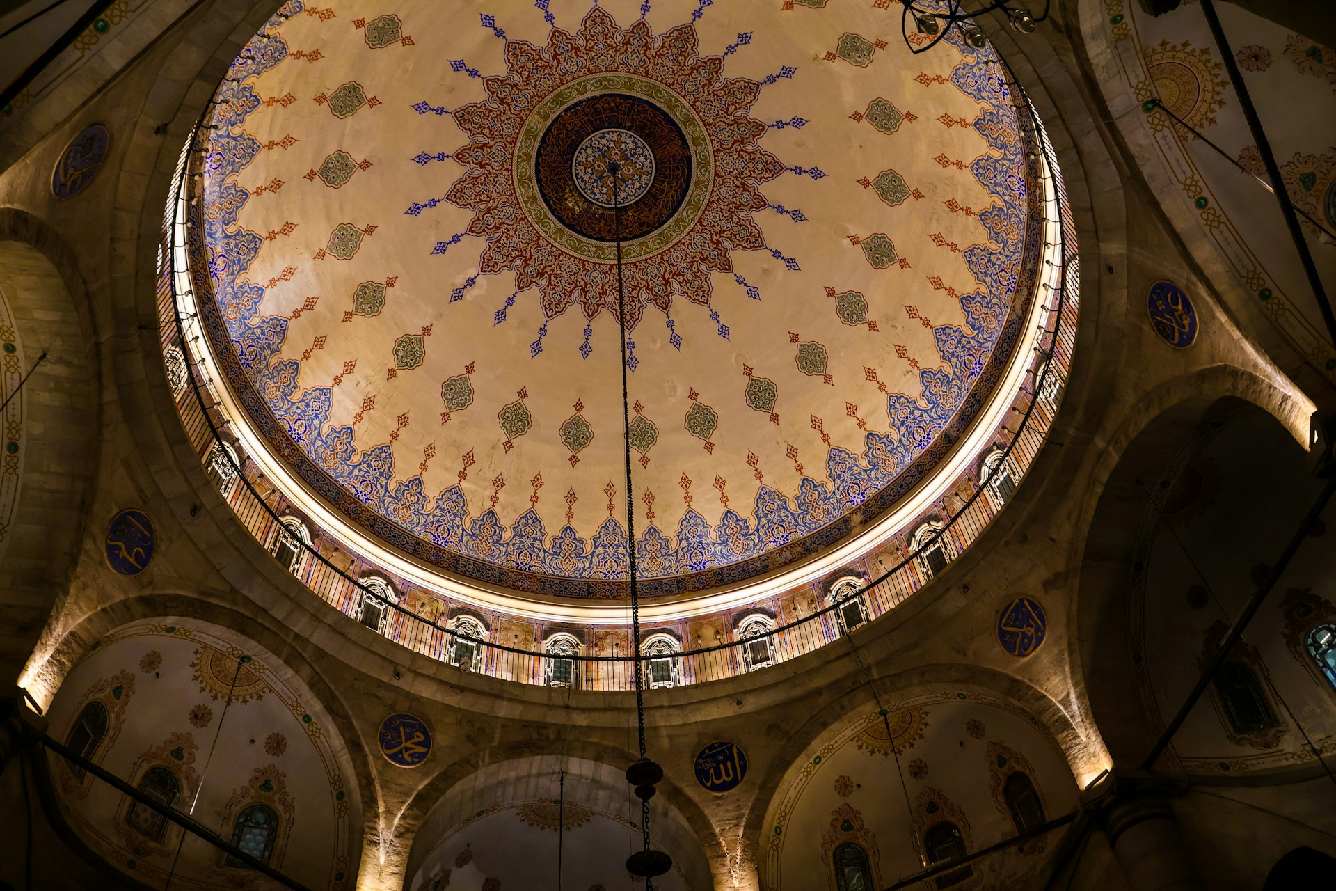 The ceiling of a large building with a dome