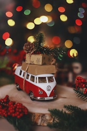 A vw bus with a christmas tree on top of it