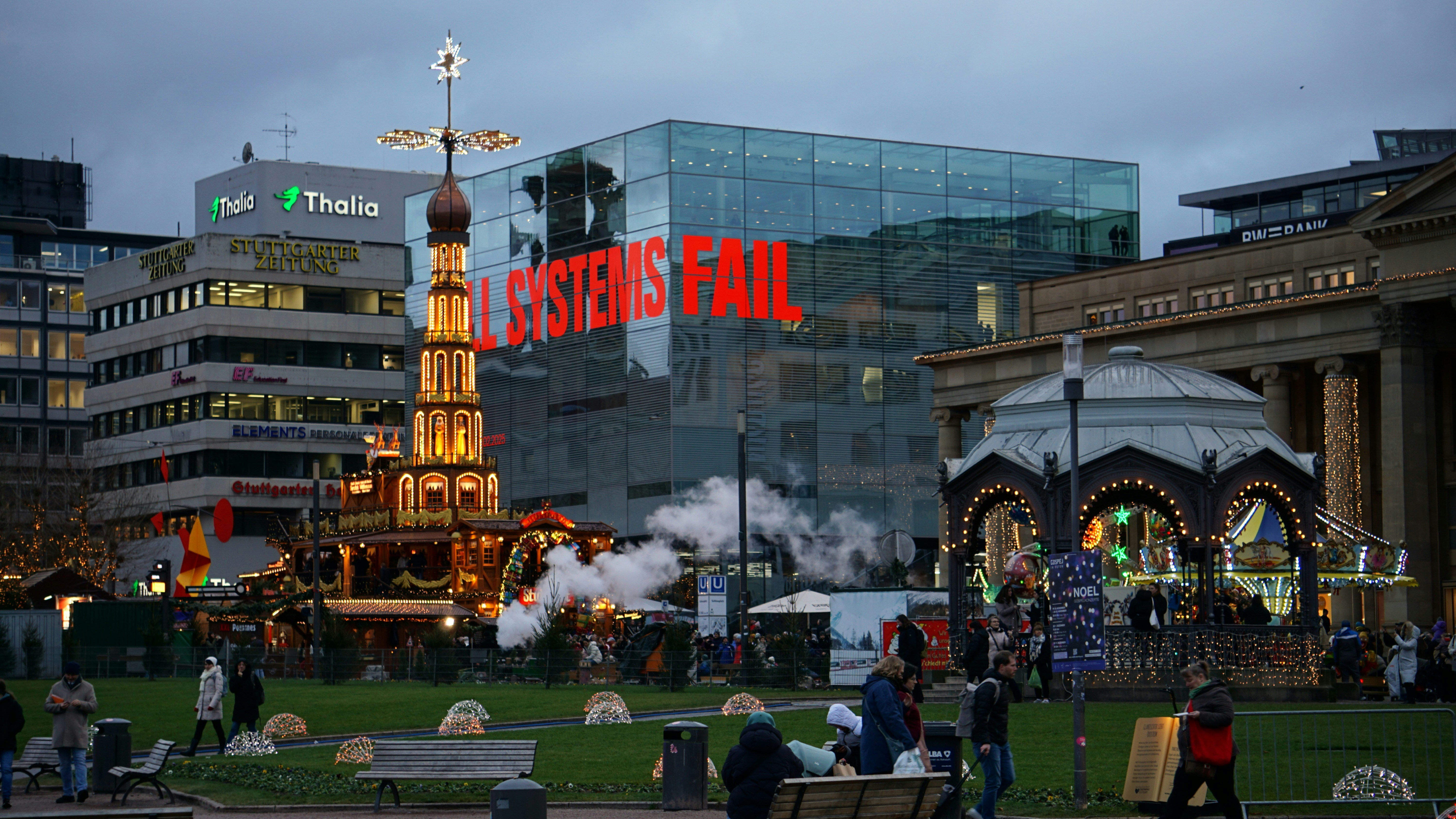 A group of people sitting on a bench in a park