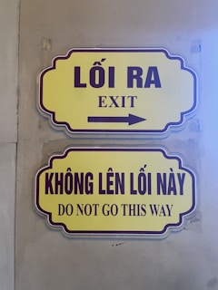A couple of signs on the side of a building