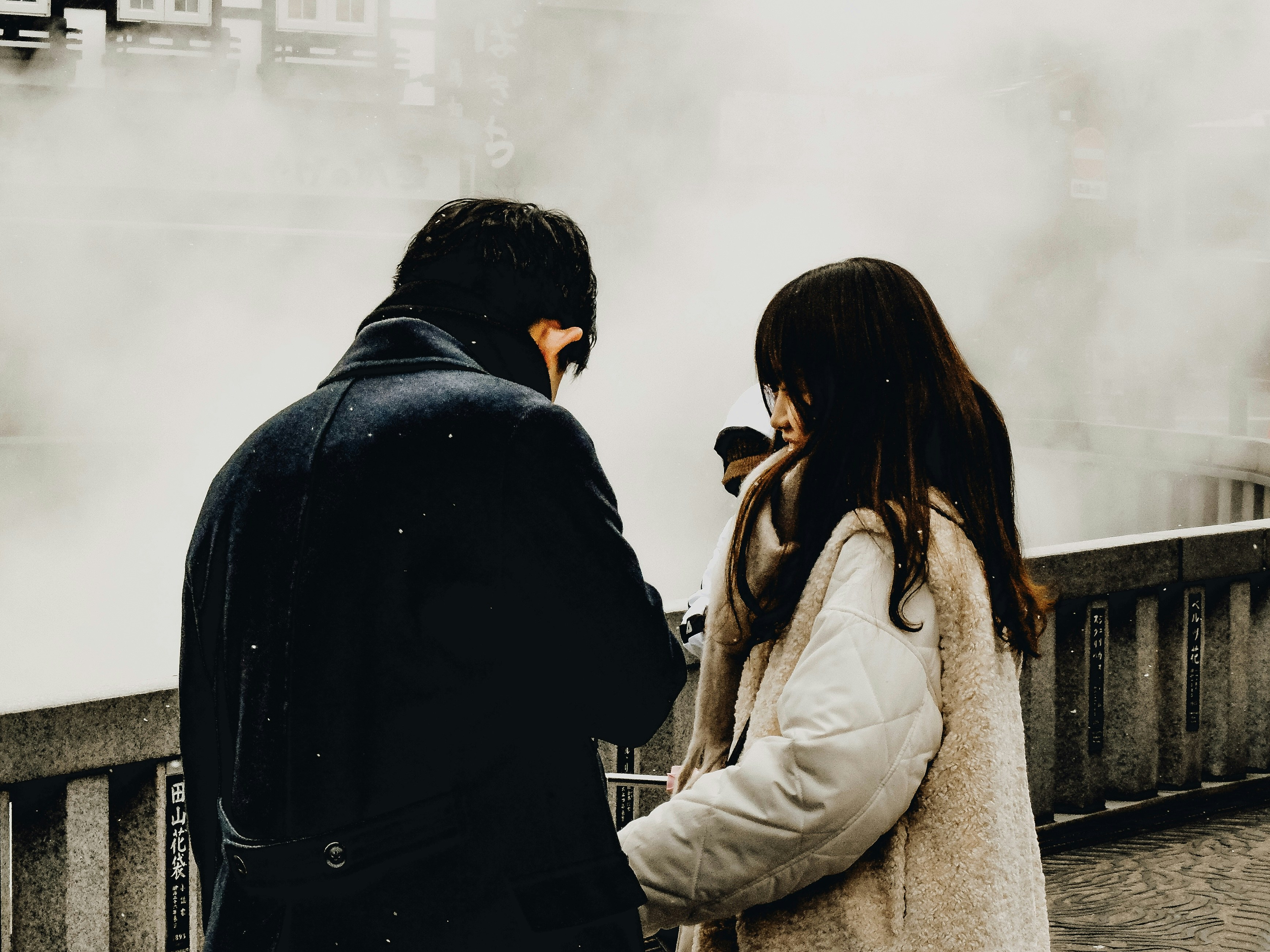 A man and a woman standing next to each other
