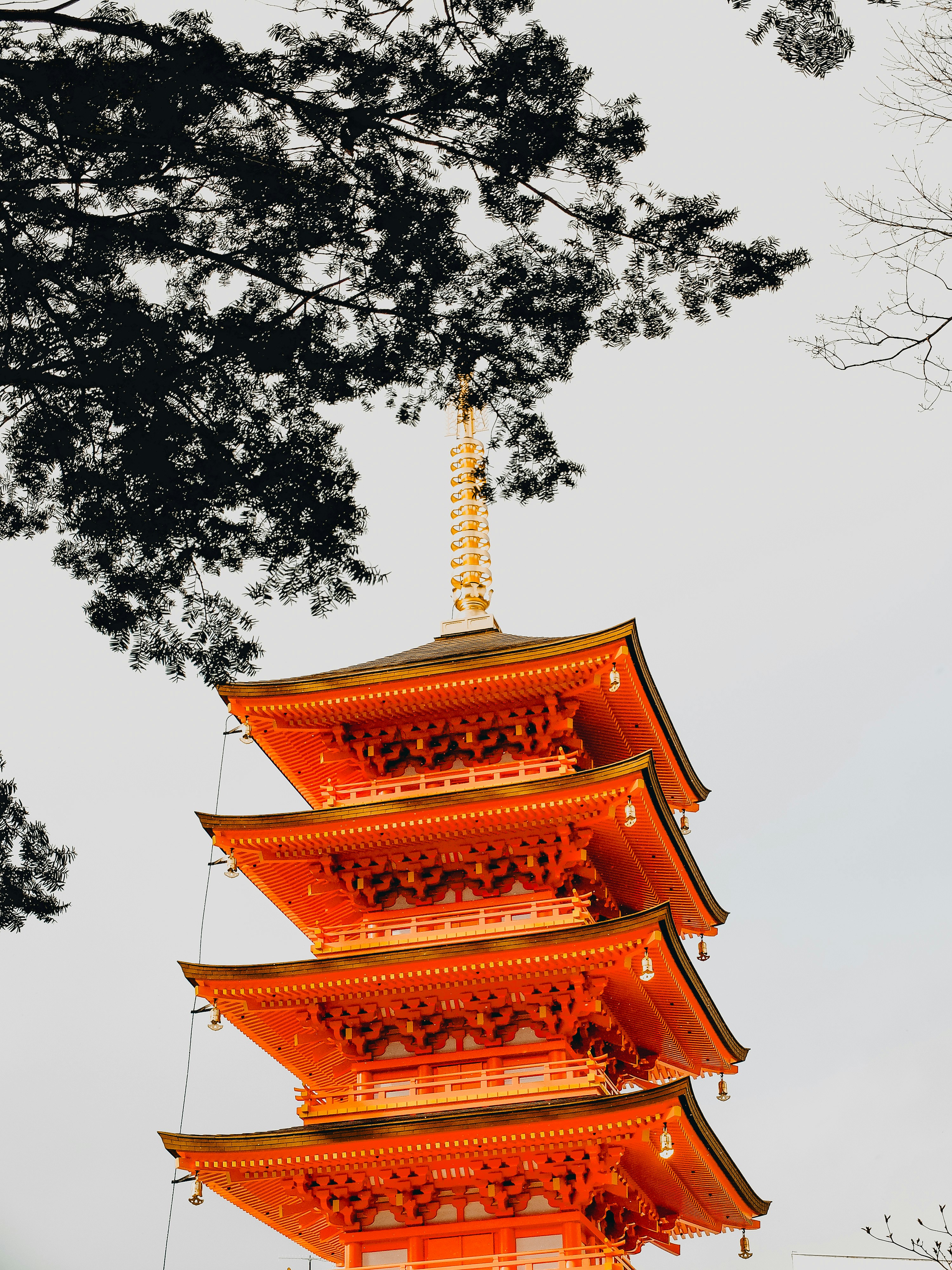 A tall orange tower with a sky background