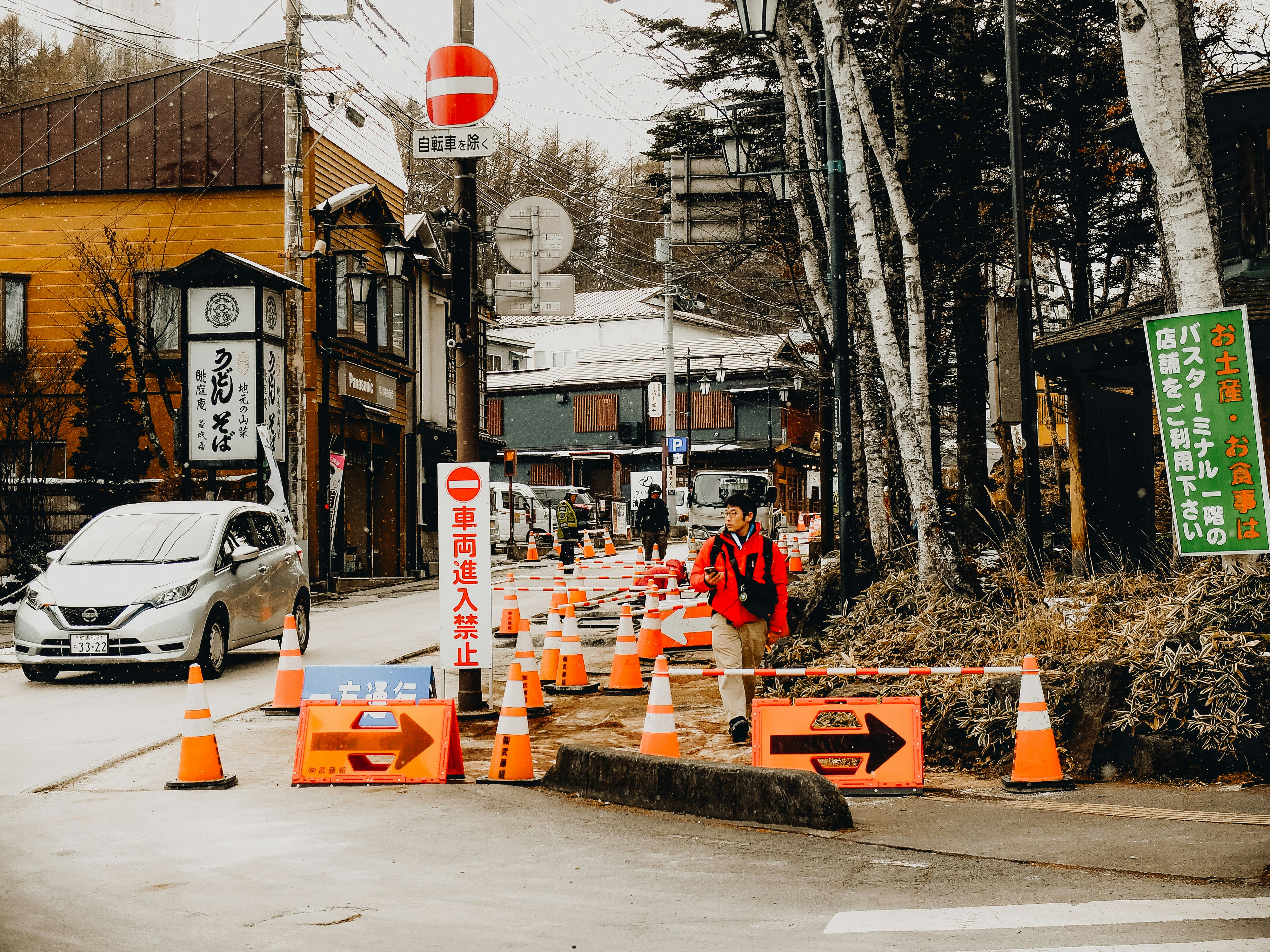A street that has a bunch of traffic cones on it