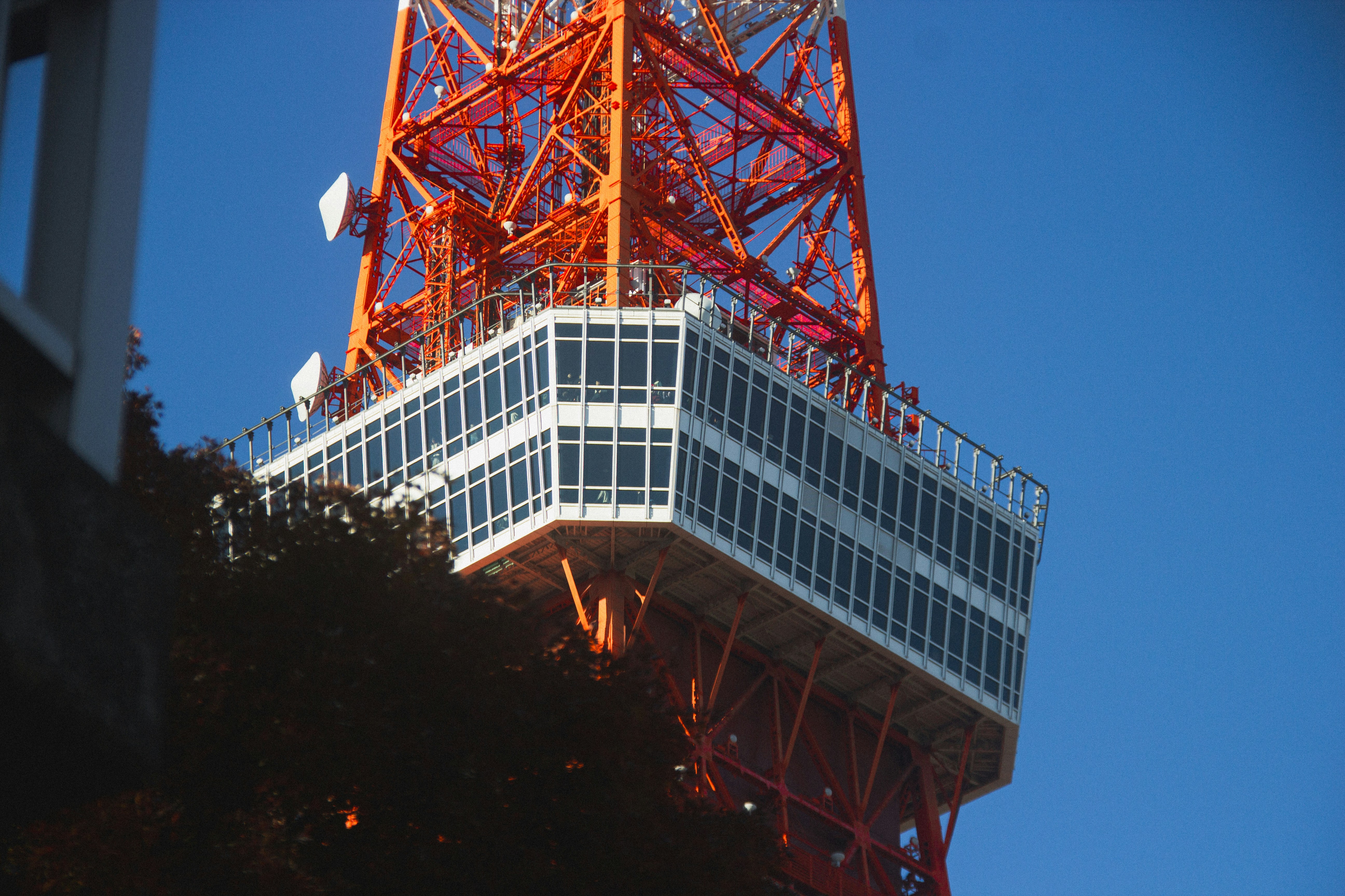 A tall tower with a flag on top of it