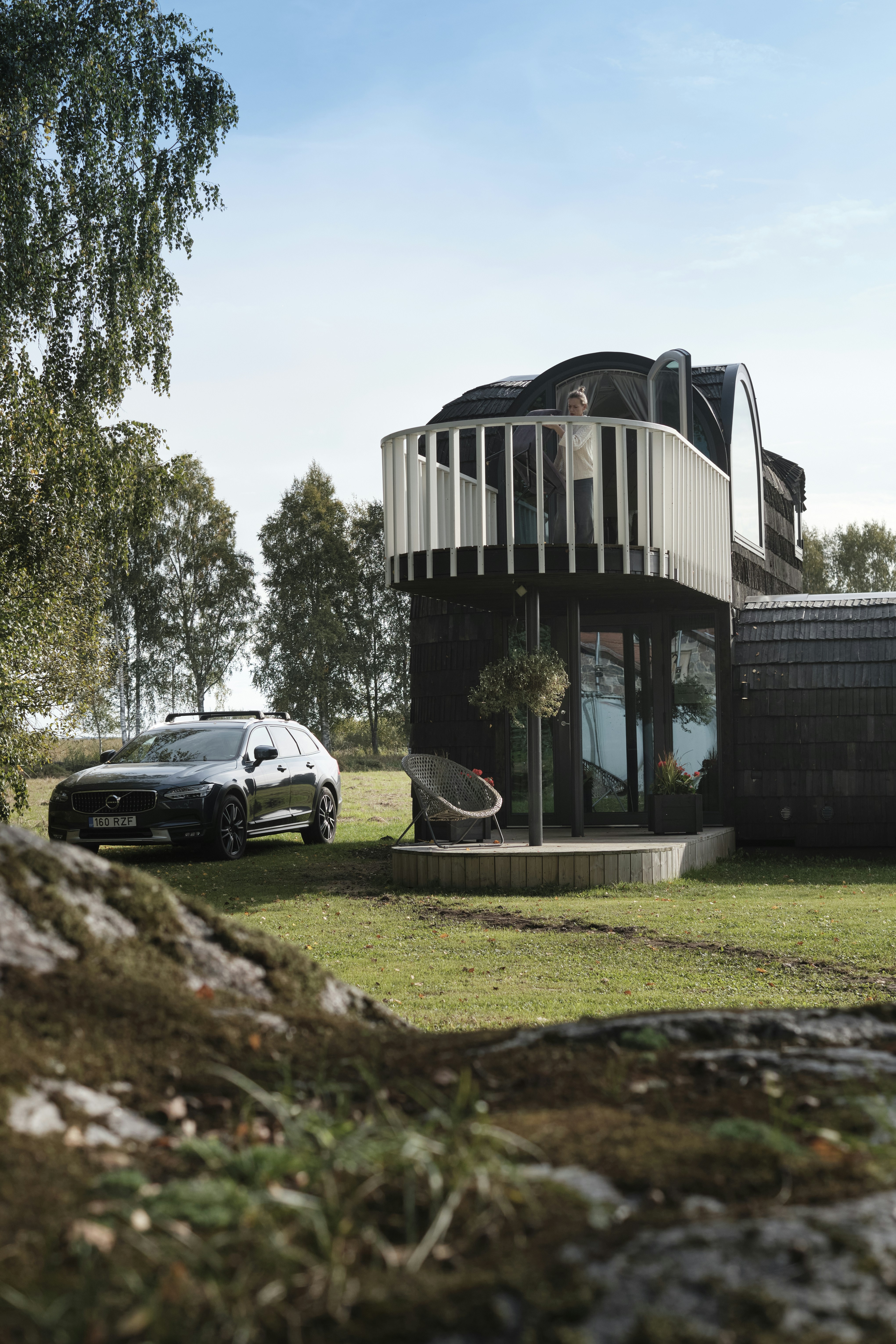 A car is parked in front of a house