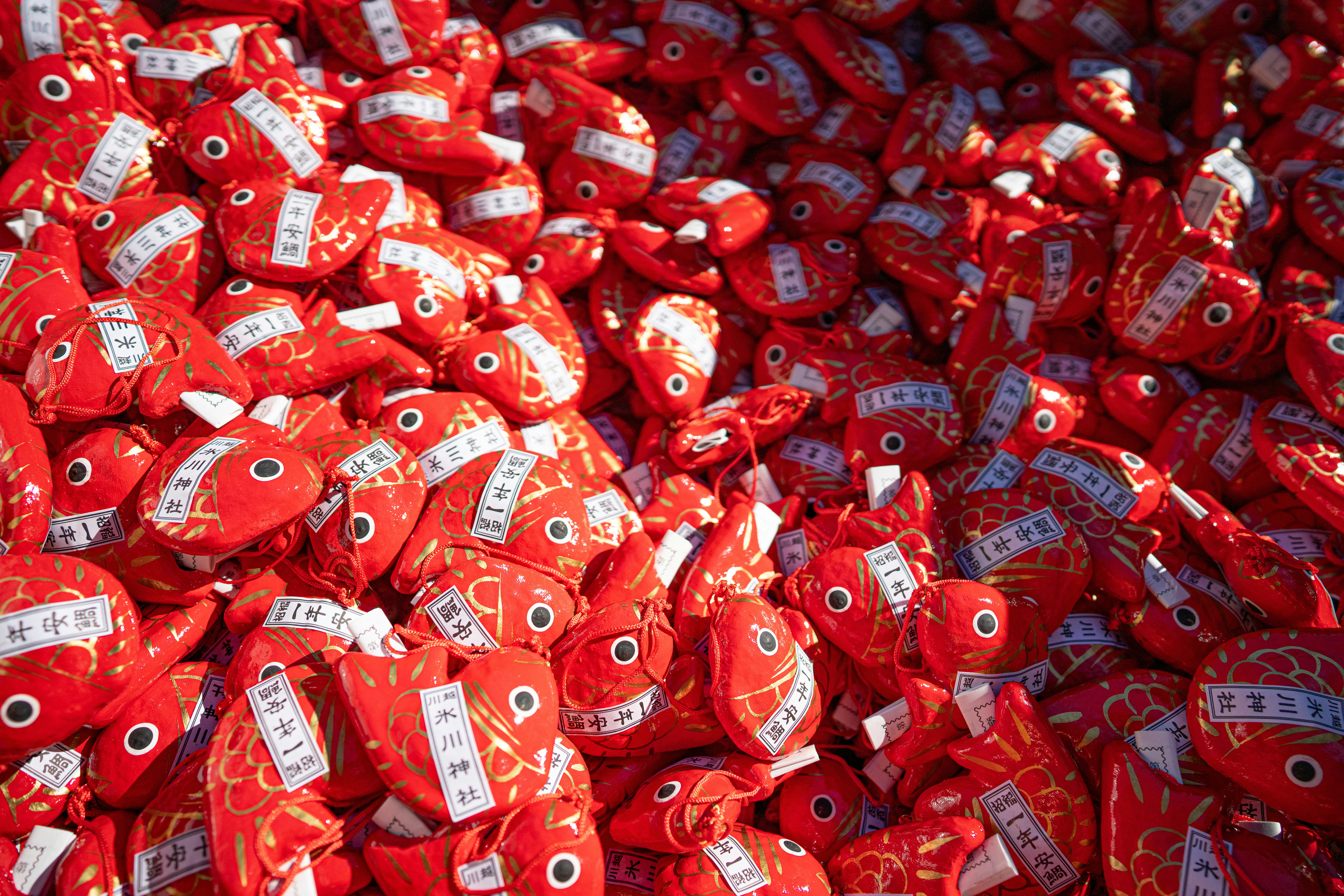 A pile of red and white candy bags