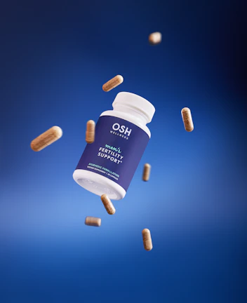 A bottle of hoo's vitamin supplement flying through the air