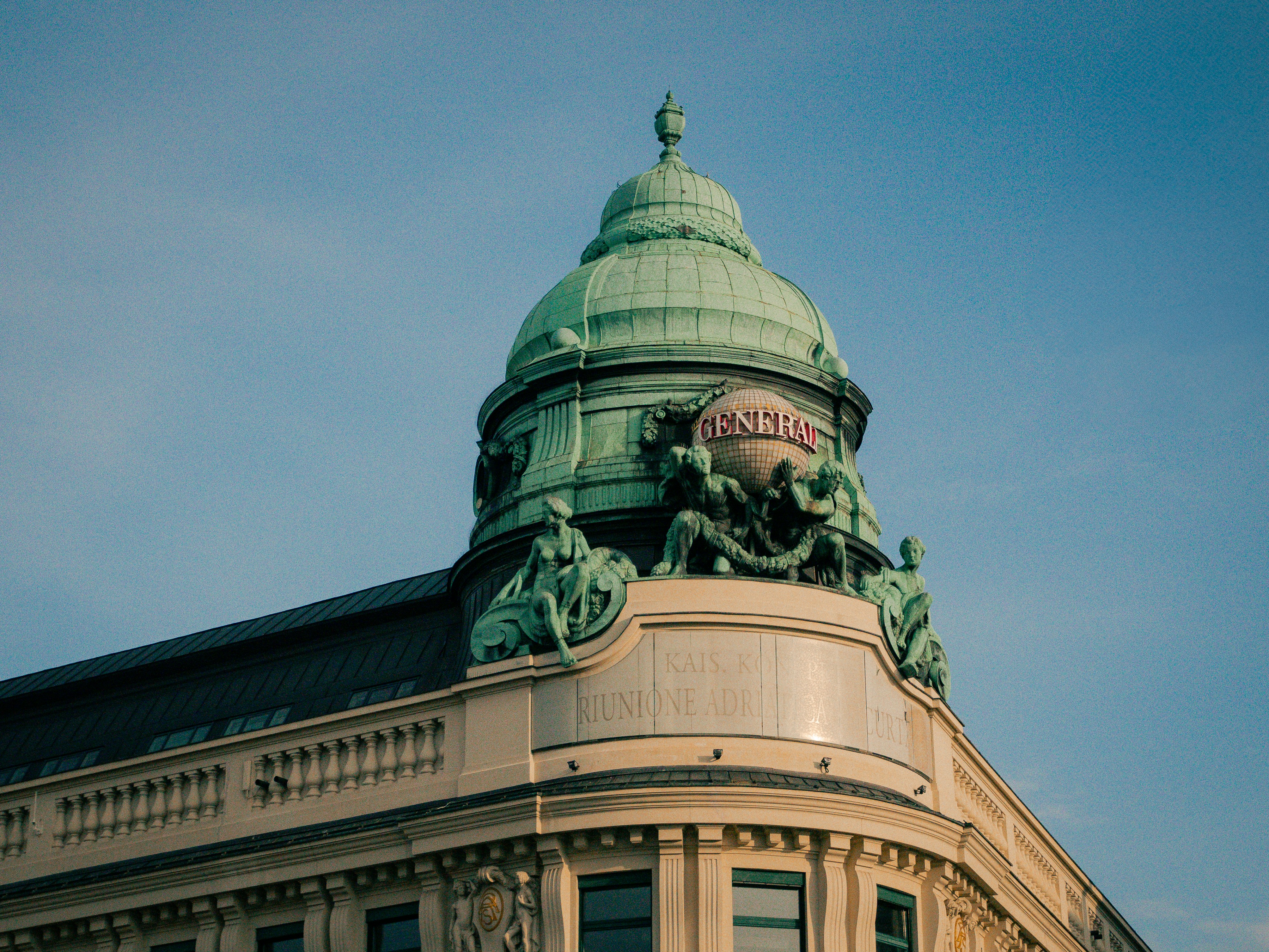 A large building with a green dome on top