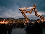 A group of people standing in front of a sign