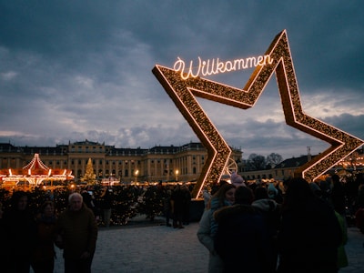 A group of people standing in front of a sign
