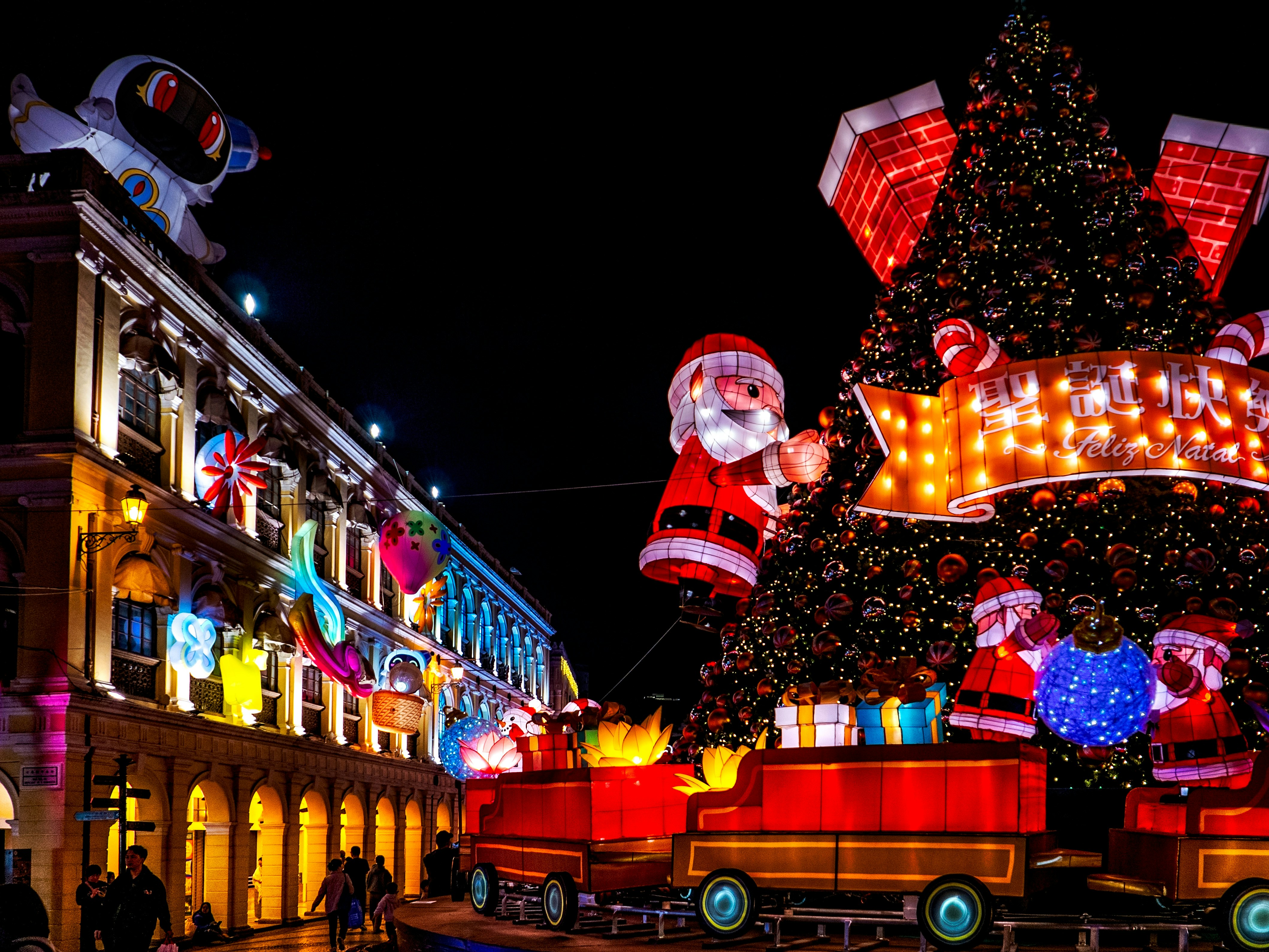 A large christmas tree in the middle of a street