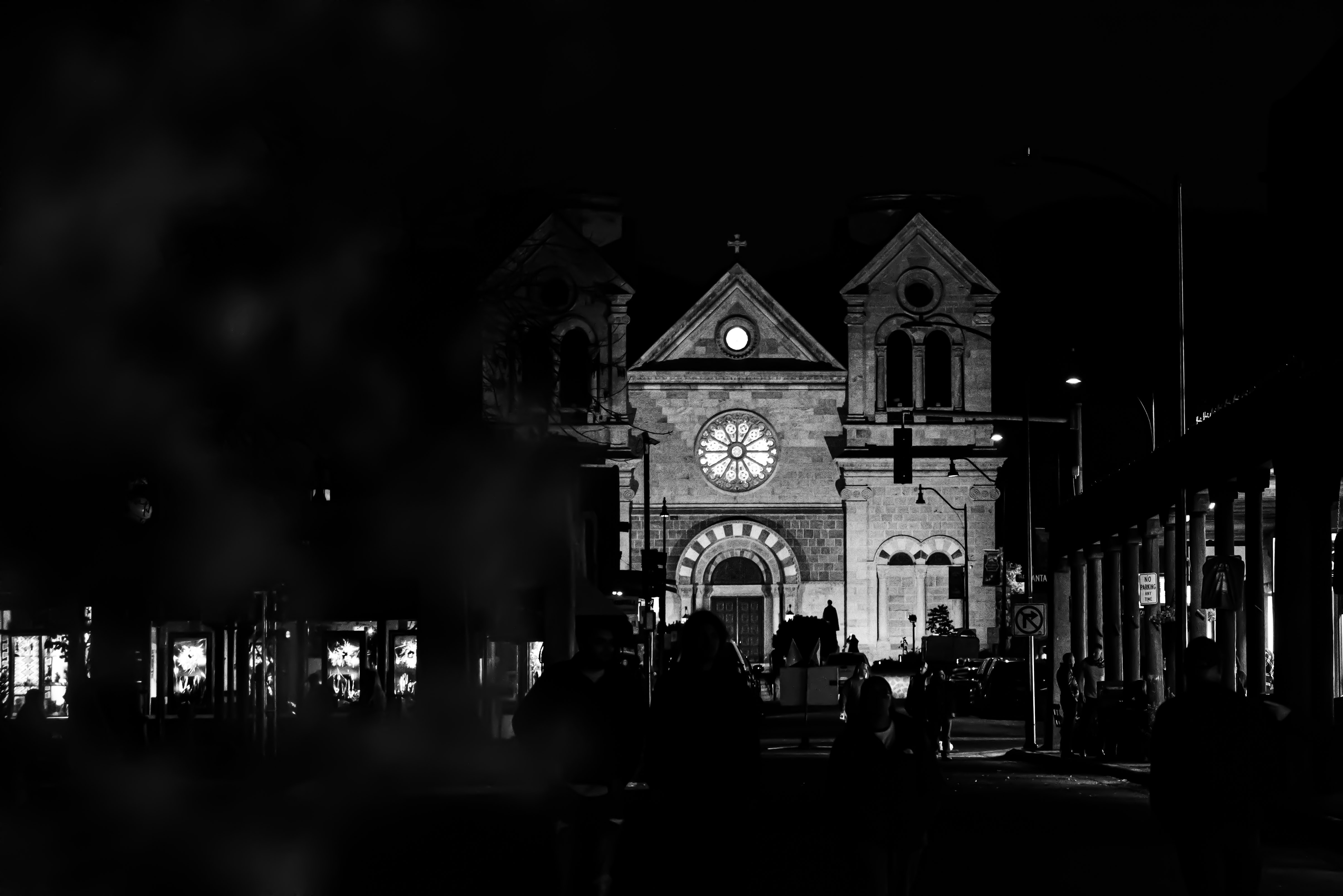 Stop image for Santa Fe to Monument Valley: 3-Day Desert Journey - A black and white photo of a clock tower -  in Southwest USA - Photo by Taylor Burnfield on Unsplash