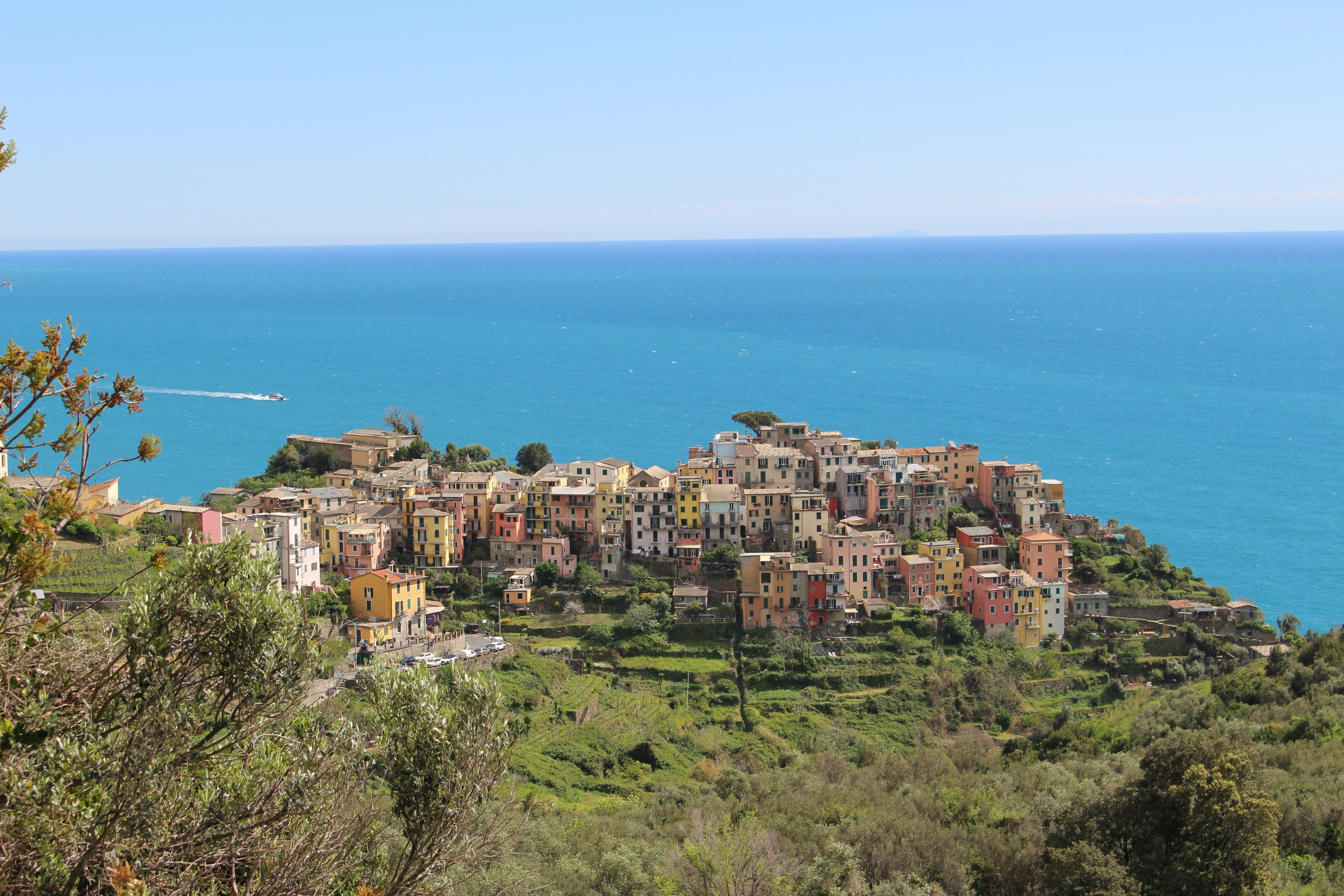 A view of a village on a hill overlooking the ocean