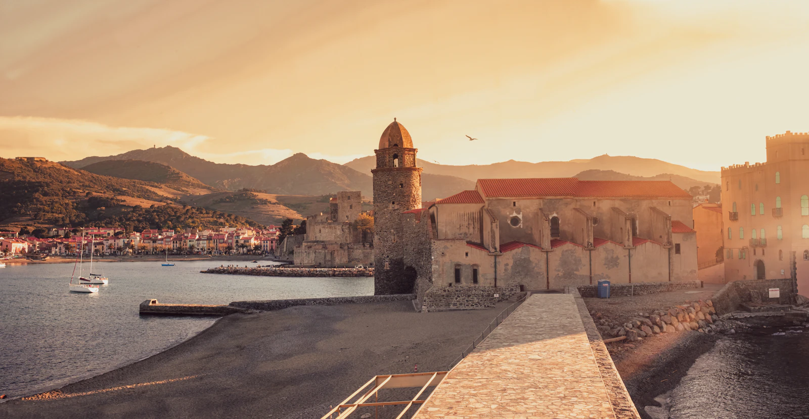 The church tower at the harbour mouth at sunset — Collioure, France