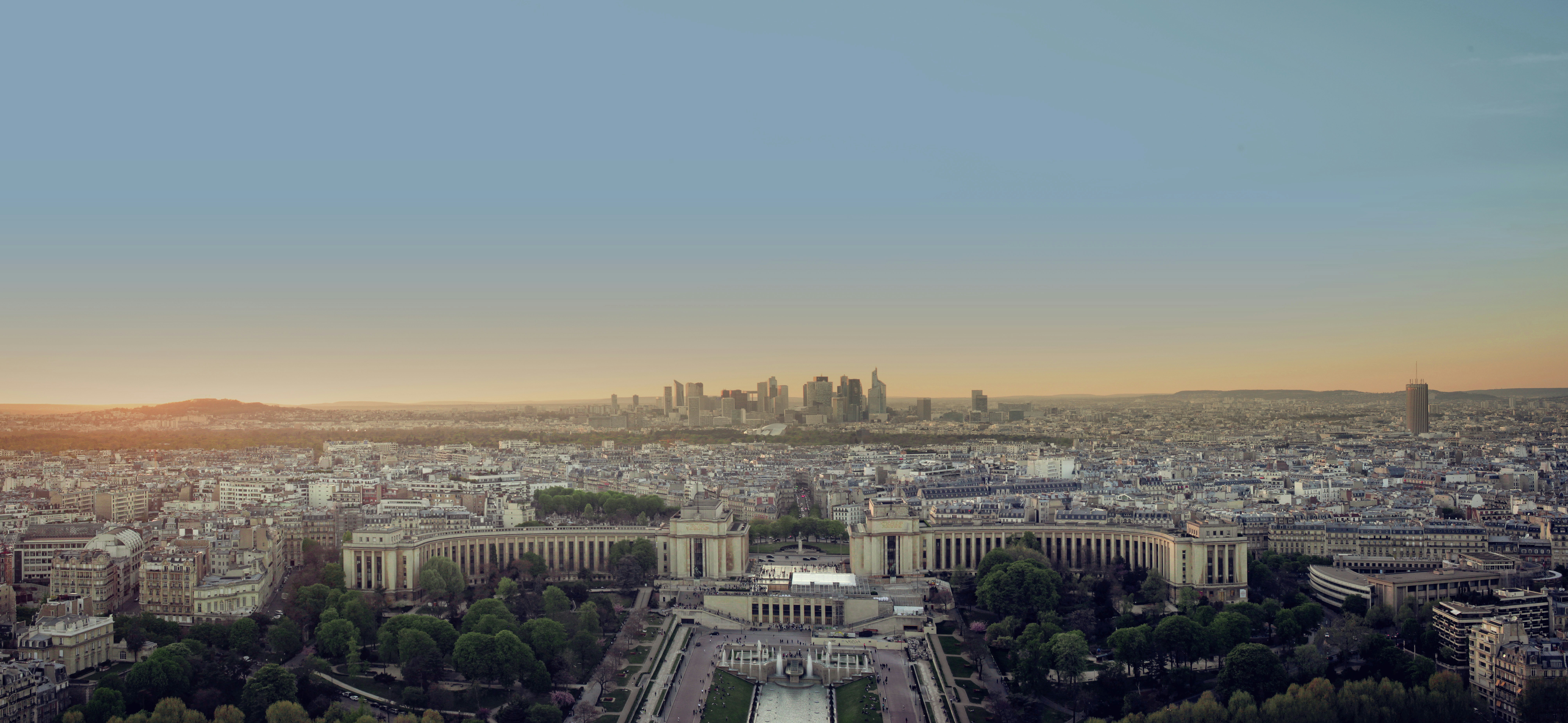An aerial view of a city at sunset