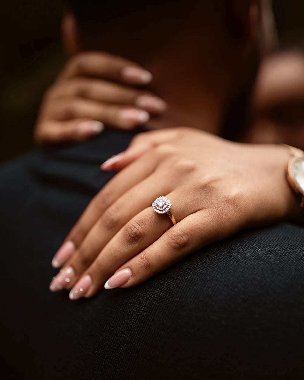 Close-up of a hand wearing an engagement ring