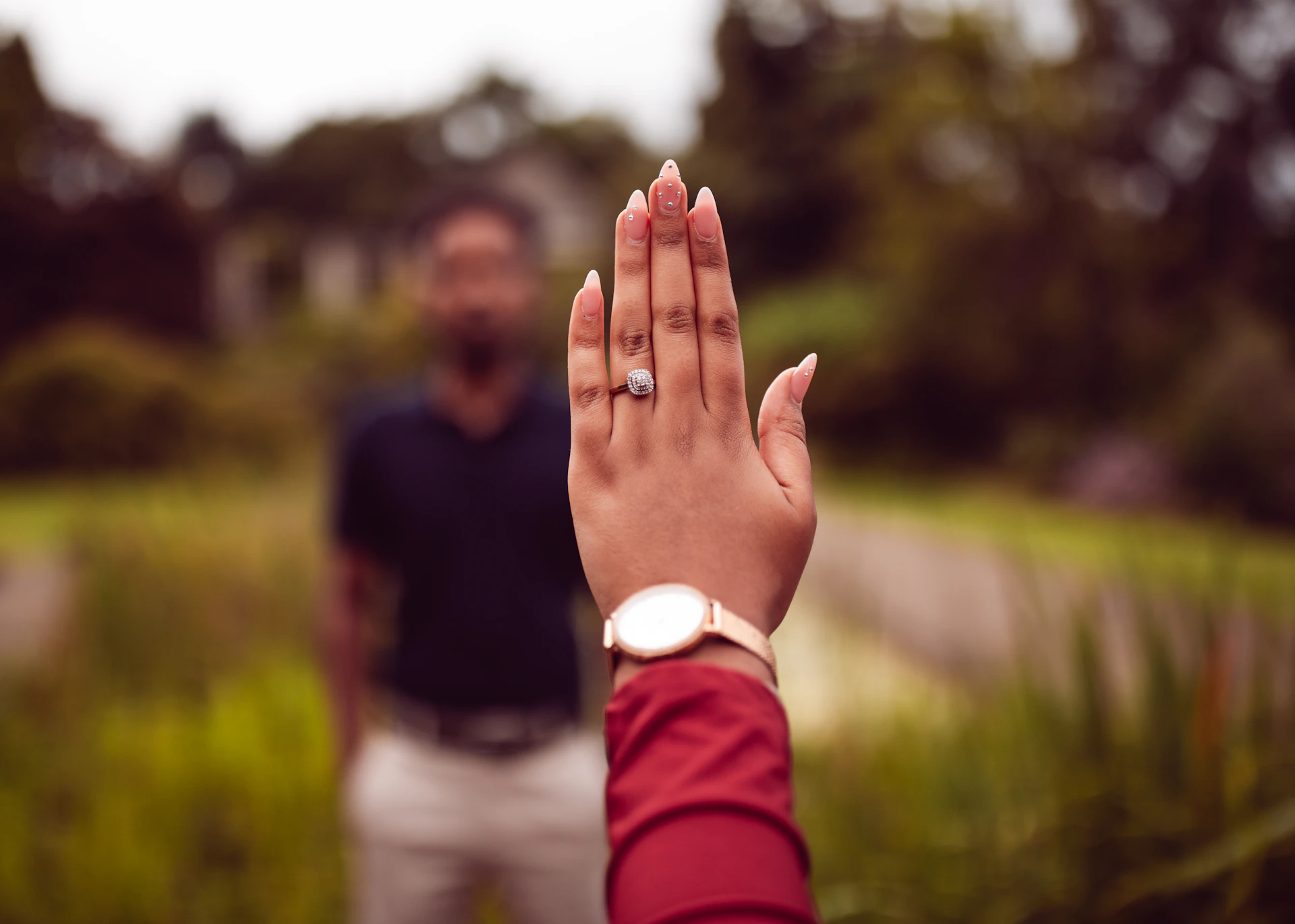 A man standing next to a woman in a field