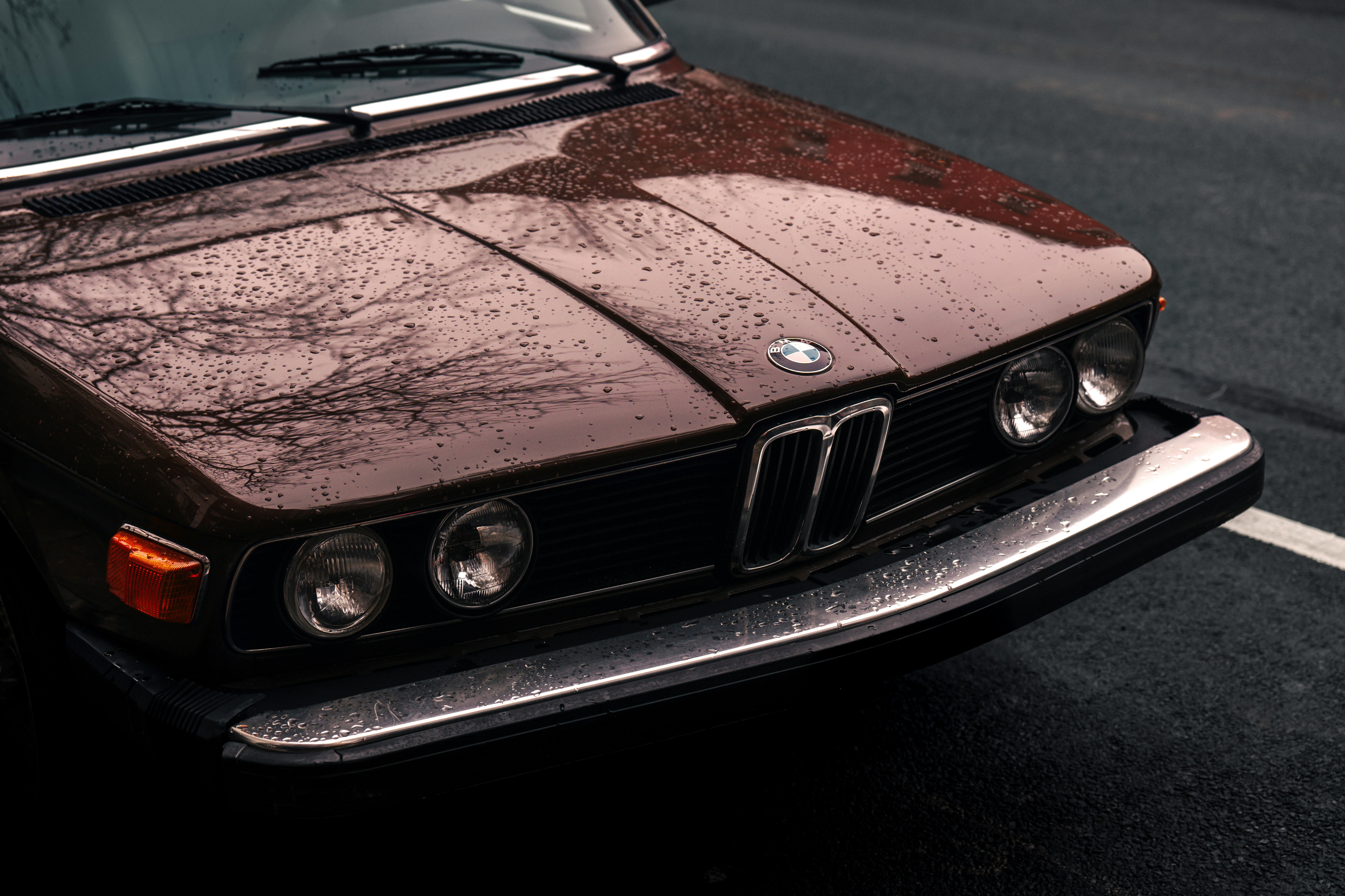 A brown car parked on the side of the road