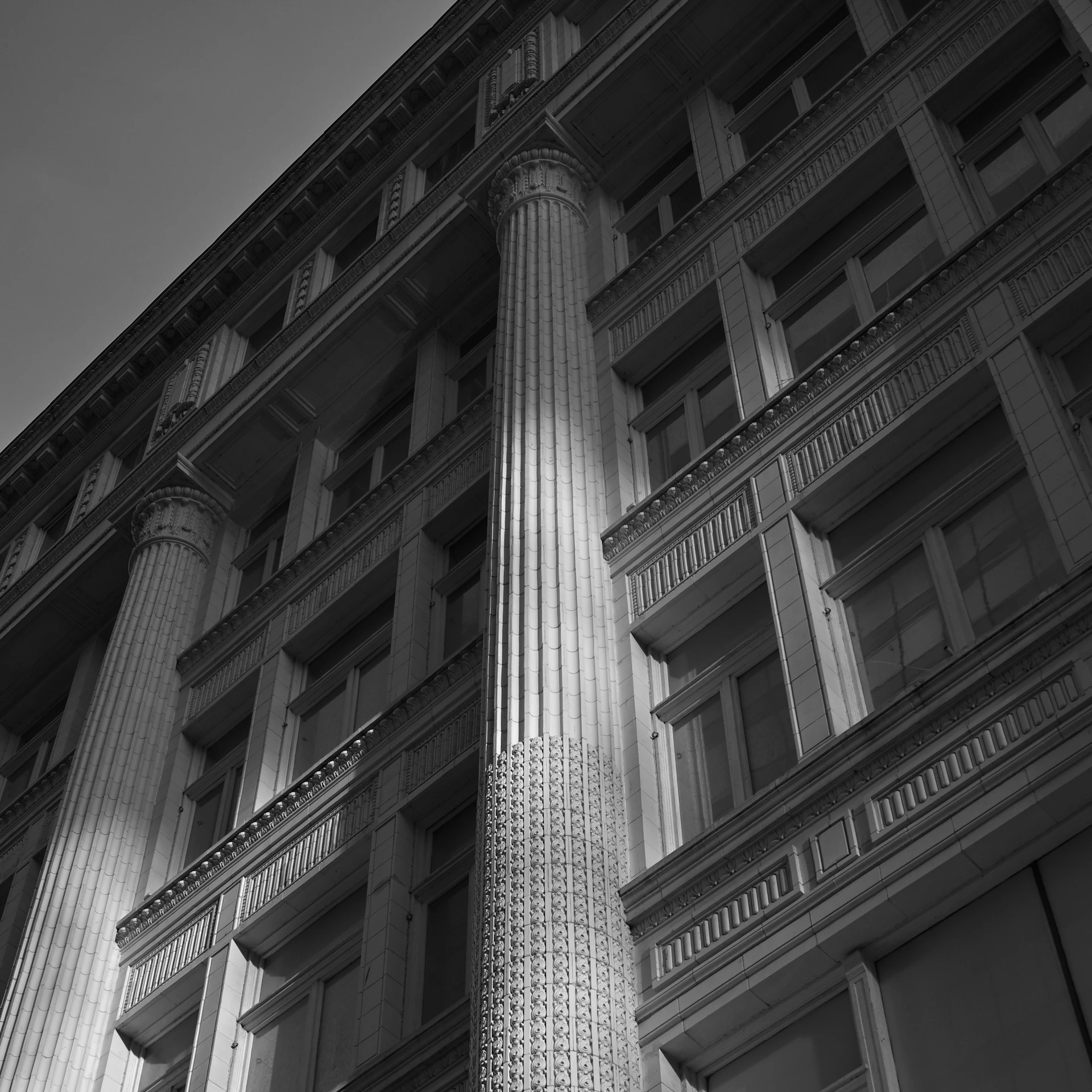 A black and white photo of a tall building