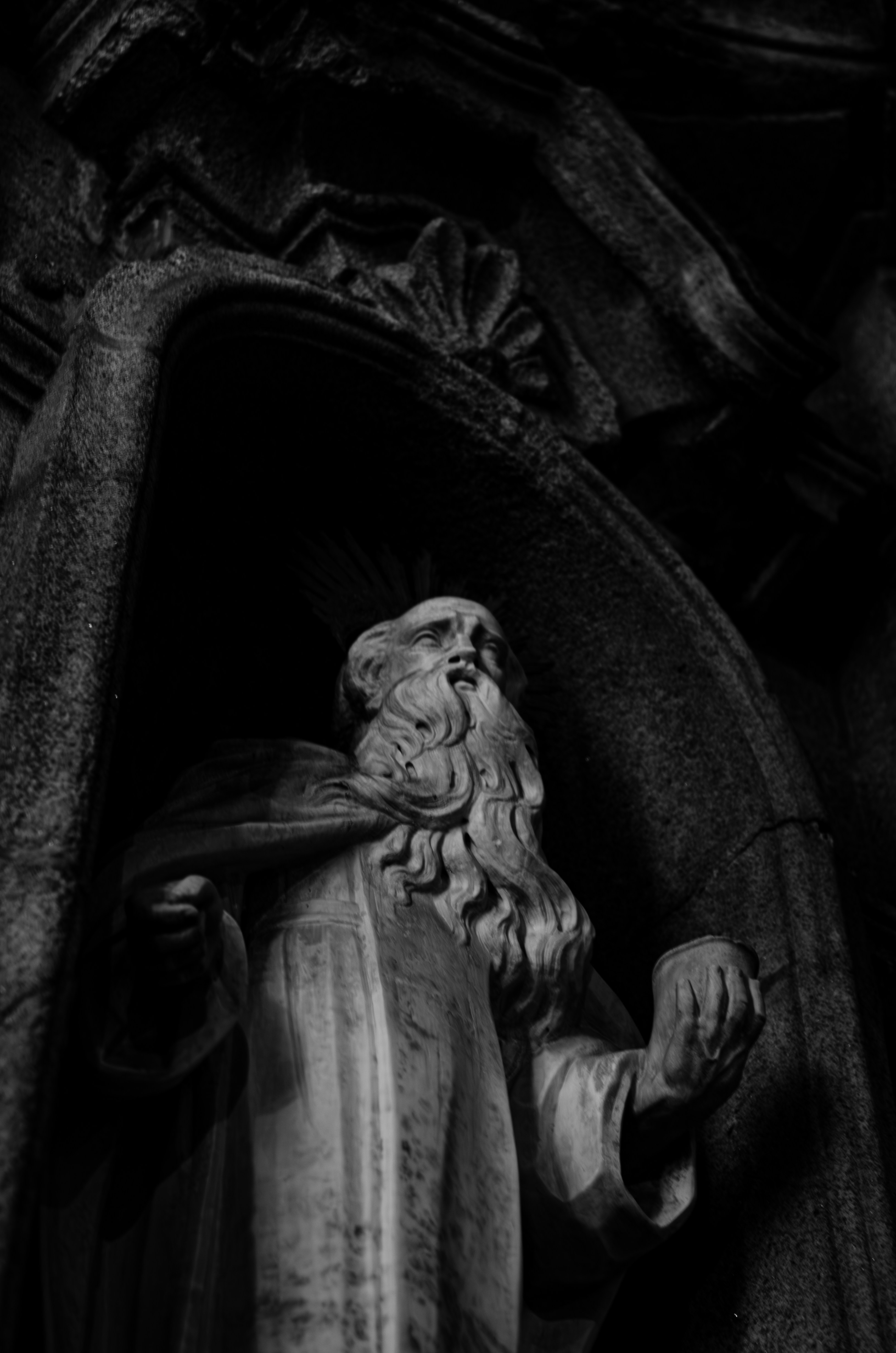 A black and white photo of a statue