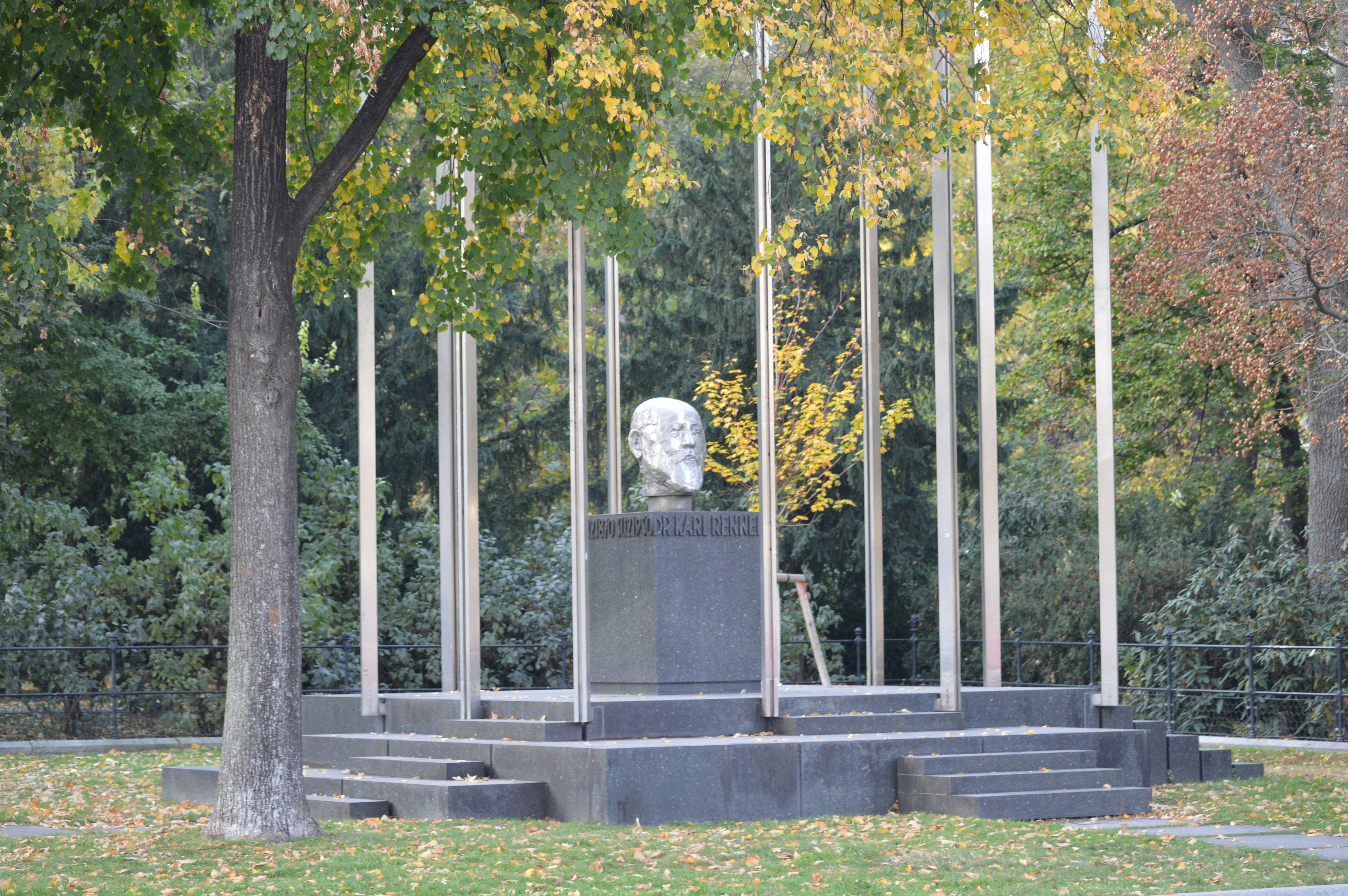 A monument in a park surrounded by trees