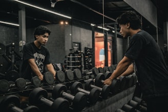 A couple of men working out in a gym