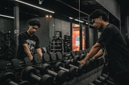 A couple of men working out in a gym